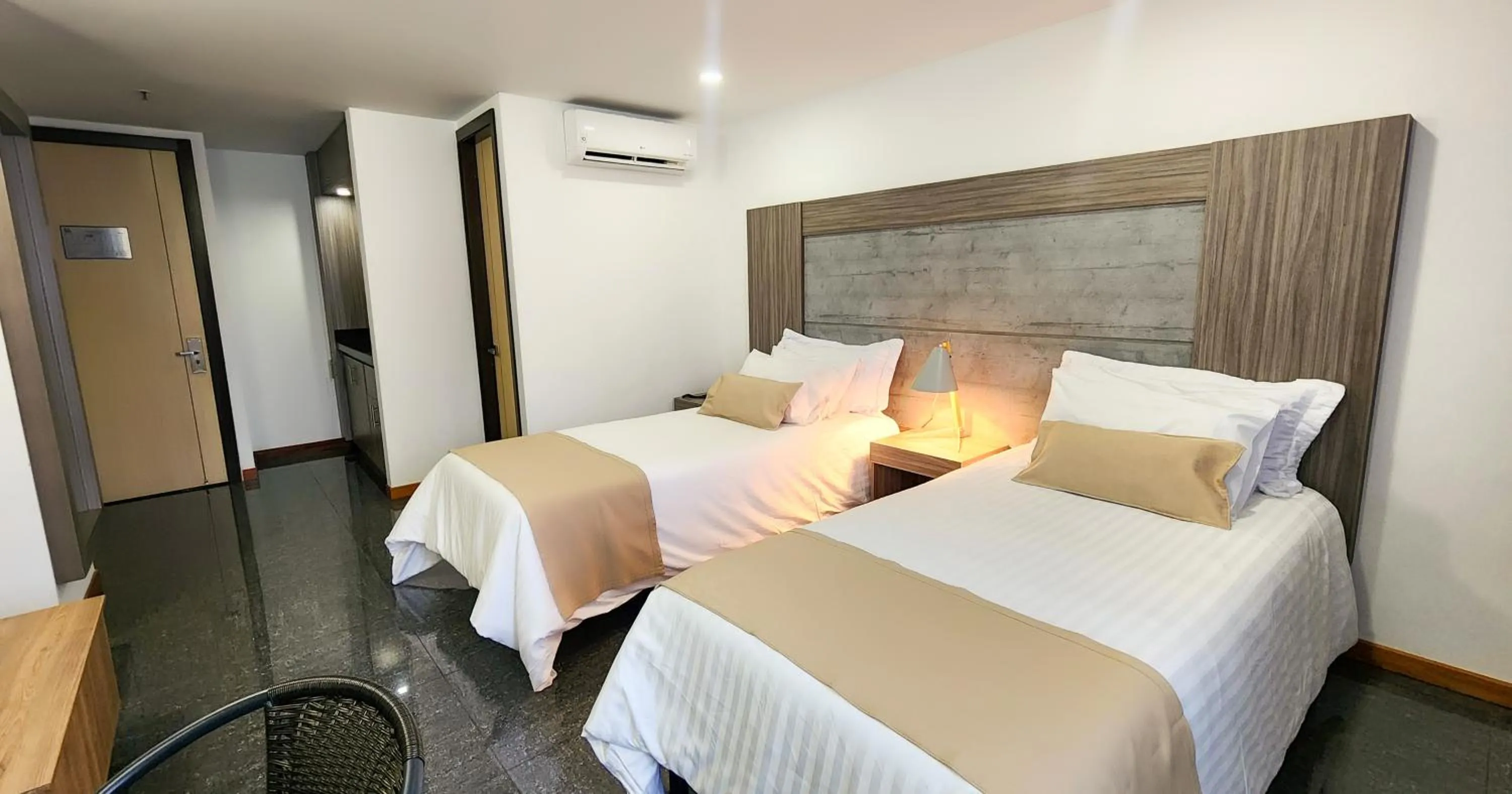 Bed in BE Suites Hotel Cali