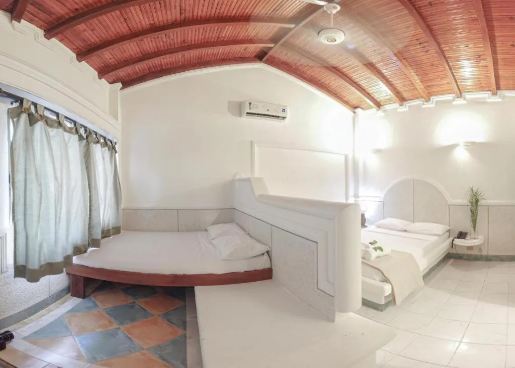 air conditioner, Bed in Hotel Cocoliso Island Resort
