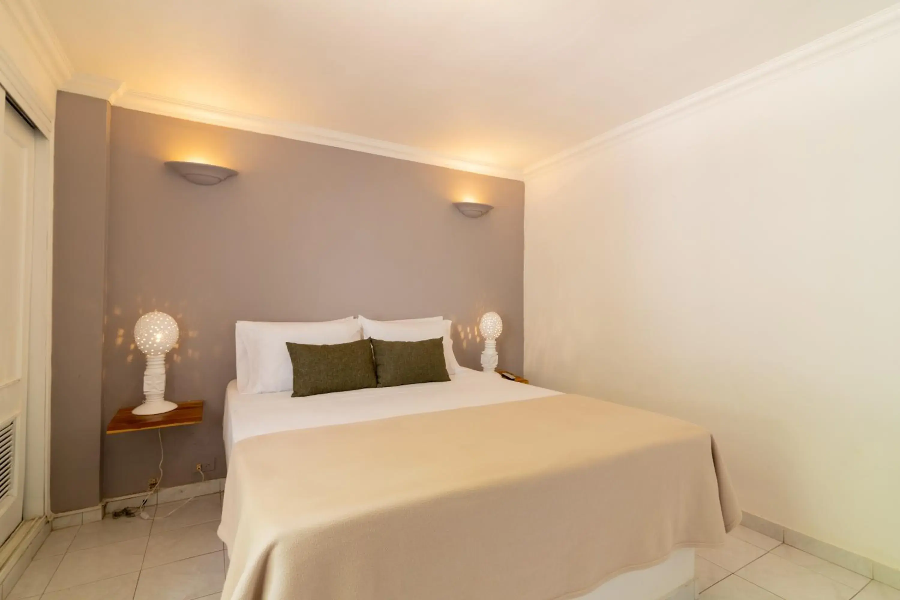 Bed in Hotel Cocoliso Island Resort Bed in Hotel Cocoliso Island Resort