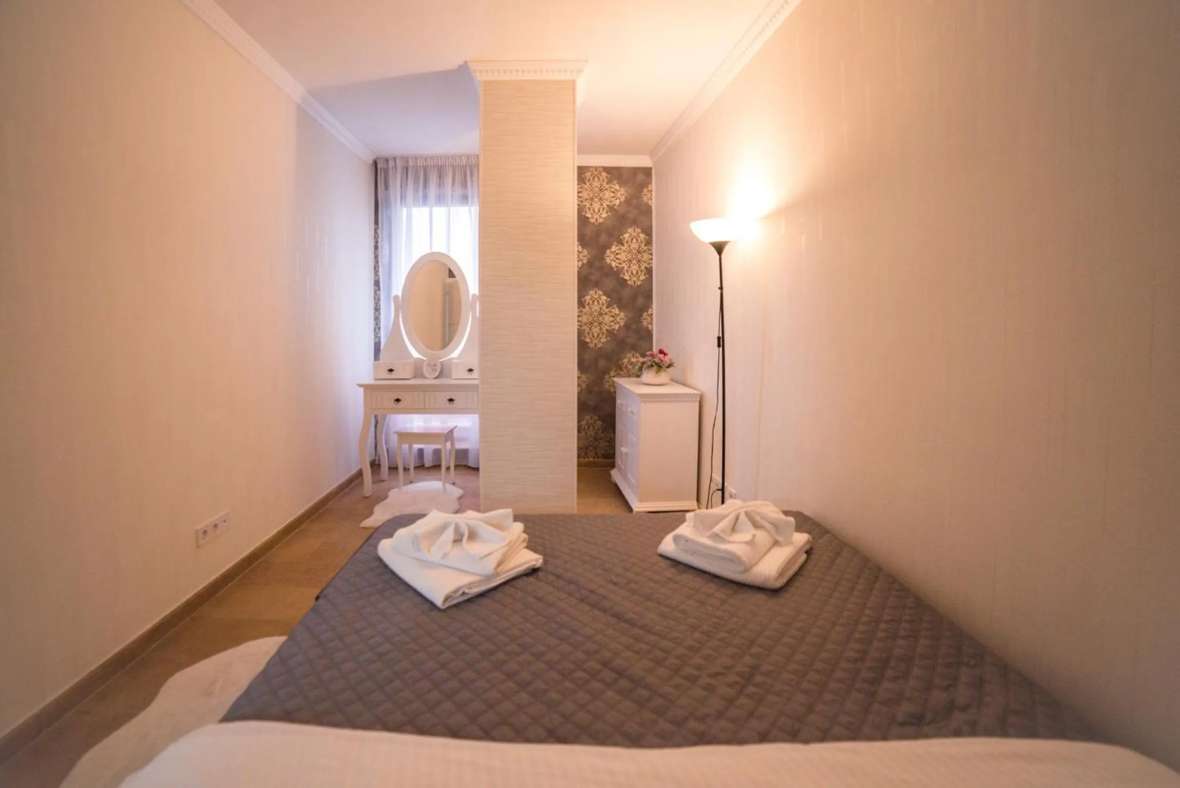 Bed in Lira Holiday Apartments