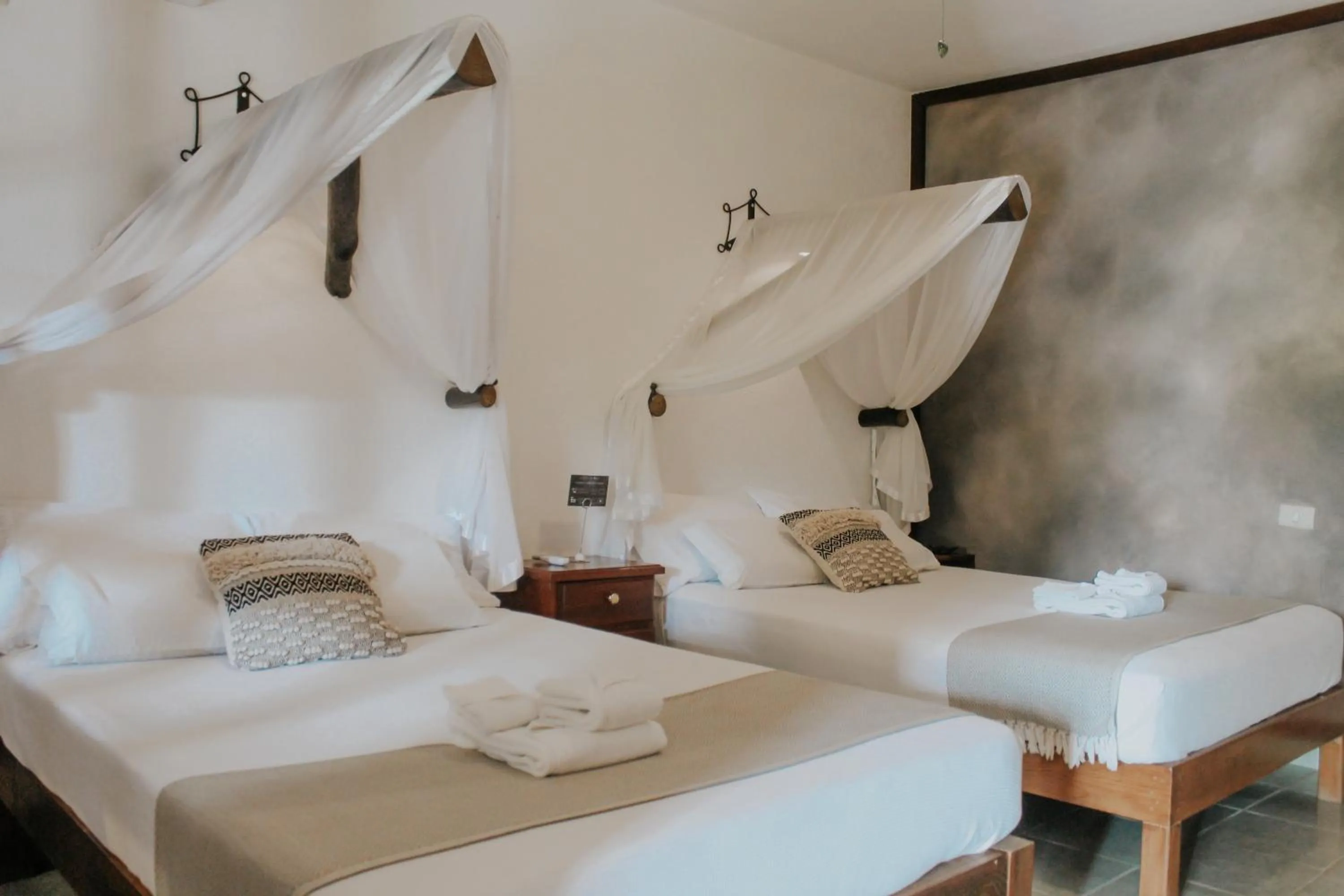 Bed in Casa de Olas Boutique Hotel