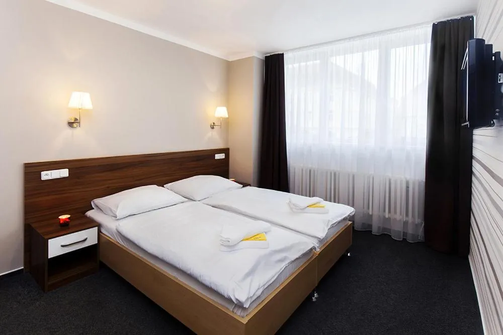 Bed in Hotel Arkáda