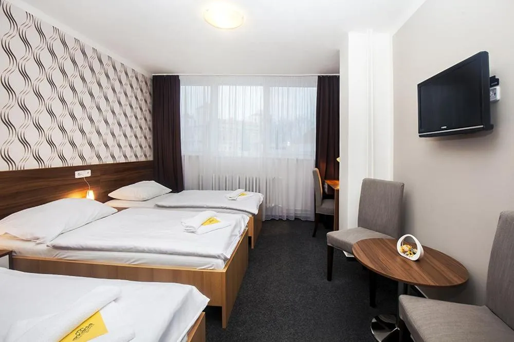 Bed in Hotel Arkáda