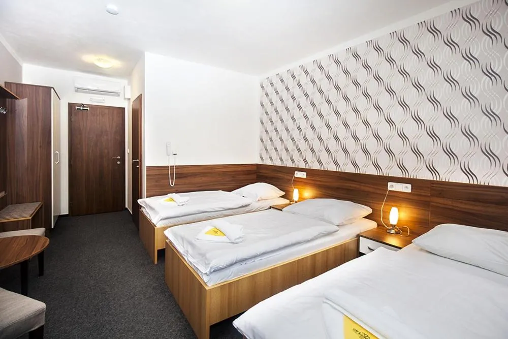 Bed in Hotel Arkáda