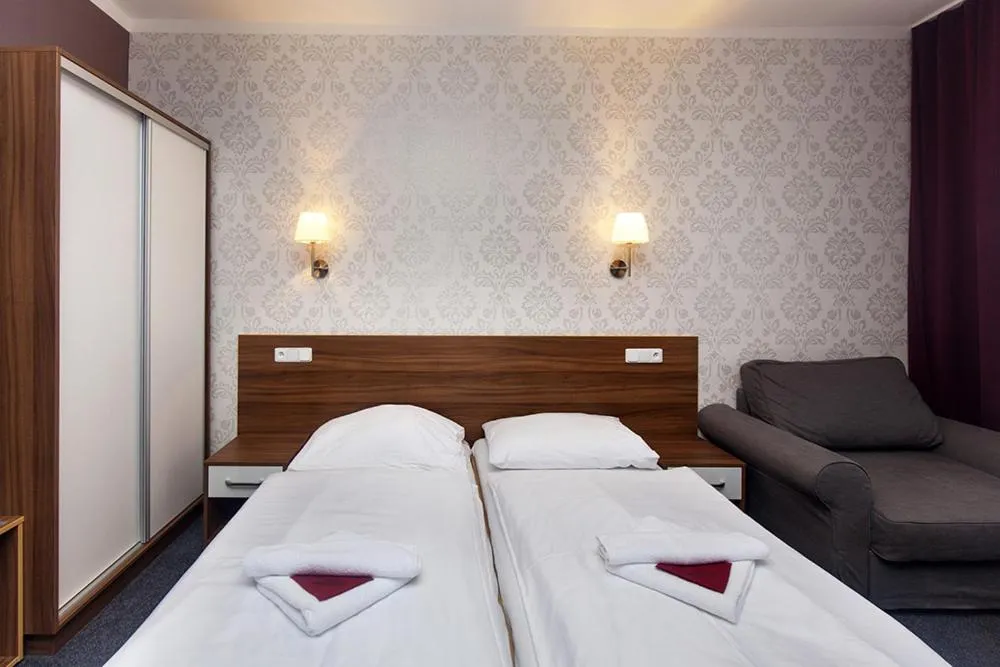 Bed in Hotel Arkáda