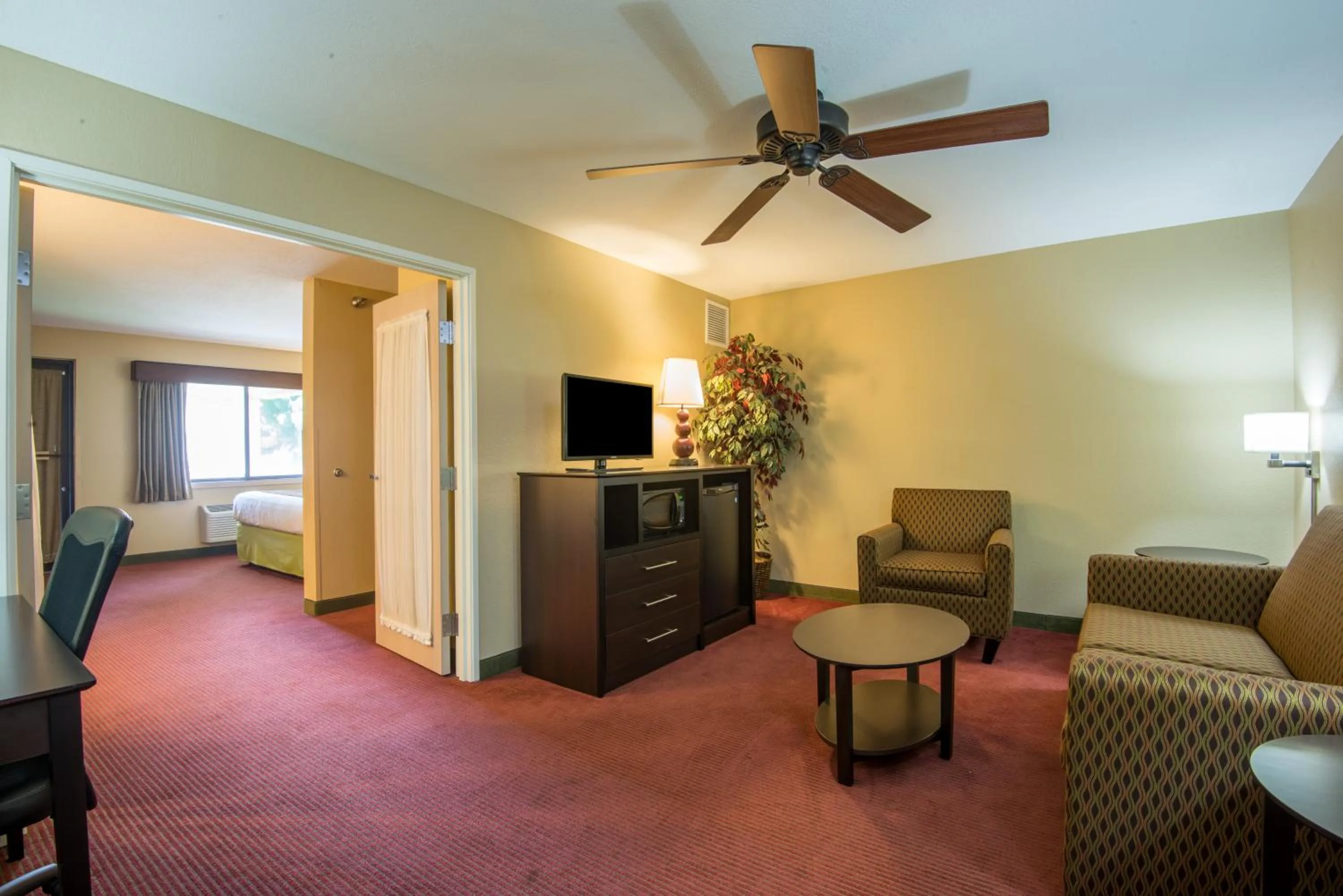 Living room in AmericInn by Wyndham Okoboji