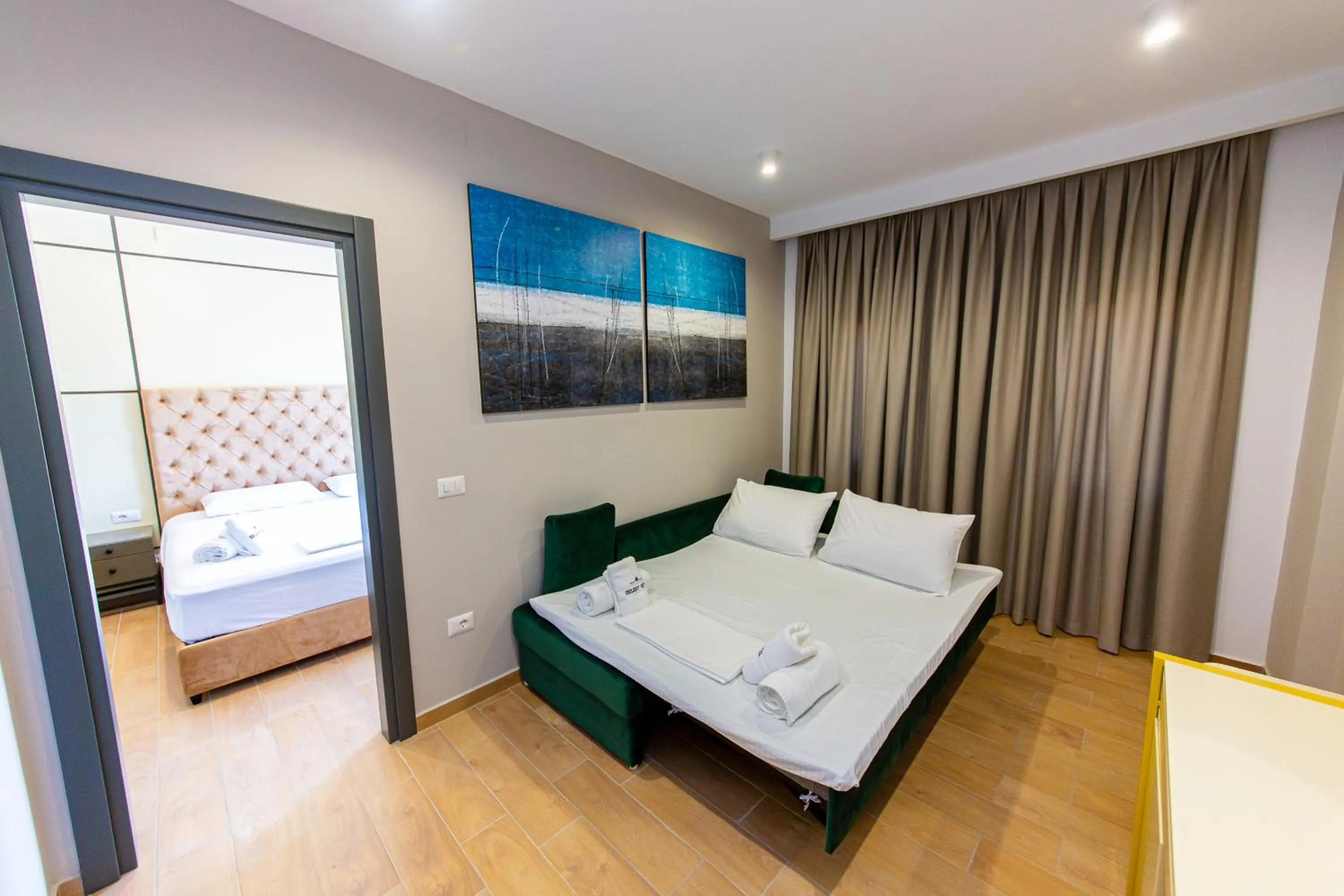 Living room, Bed in Delight Hotel