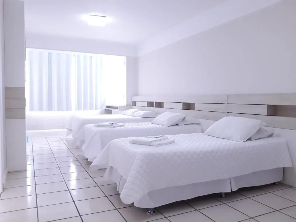 Bed in Hotel Araçá