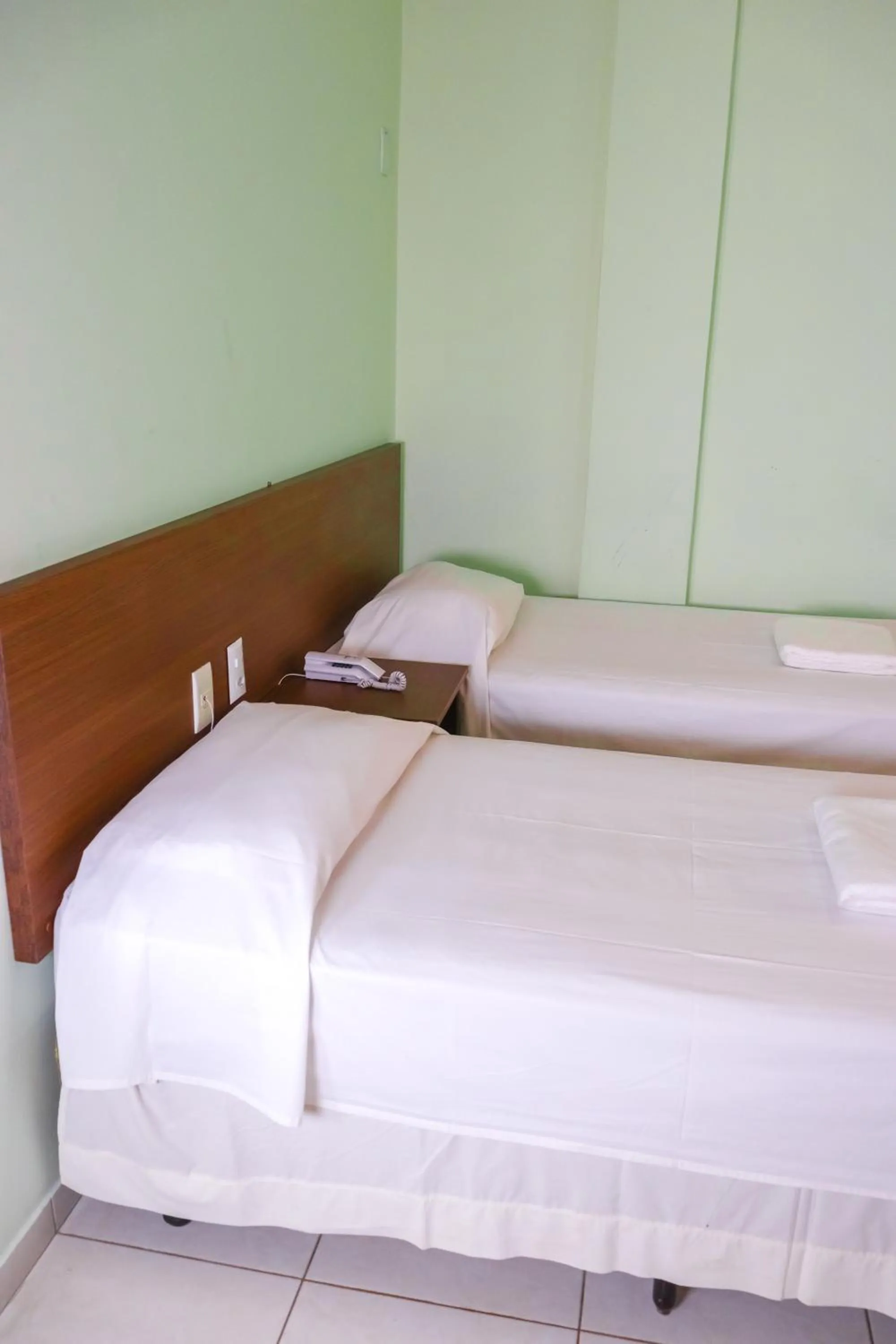 Bed in Trindade Plaza Hotel