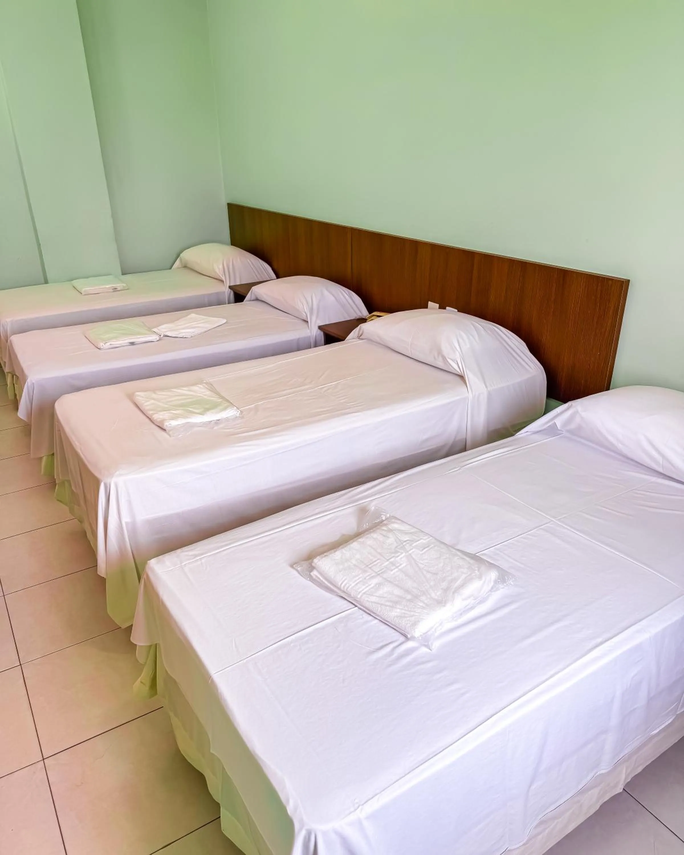 Bed in Trindade Plaza Hotel