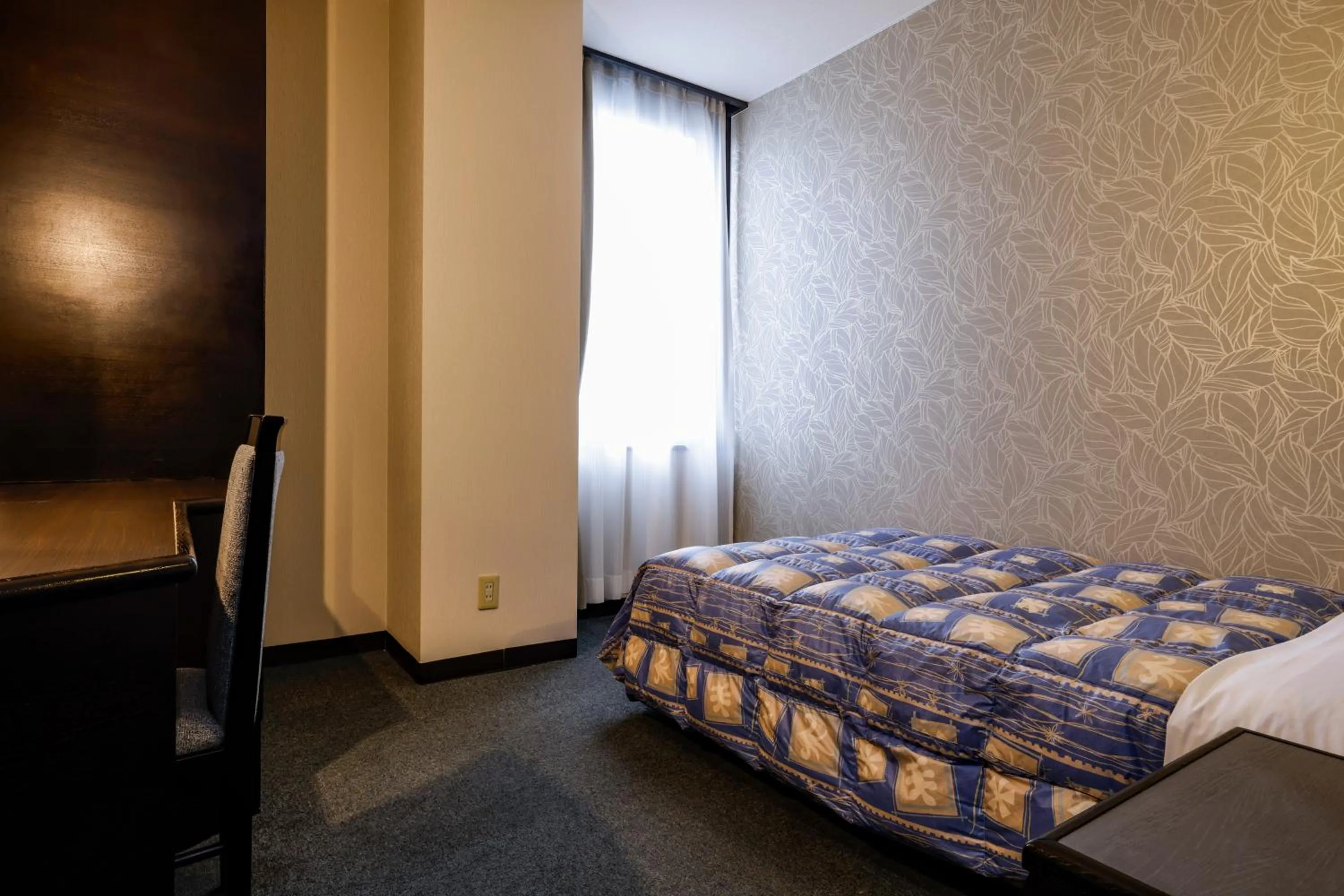 Bed in Kotohira Riverside Hotel