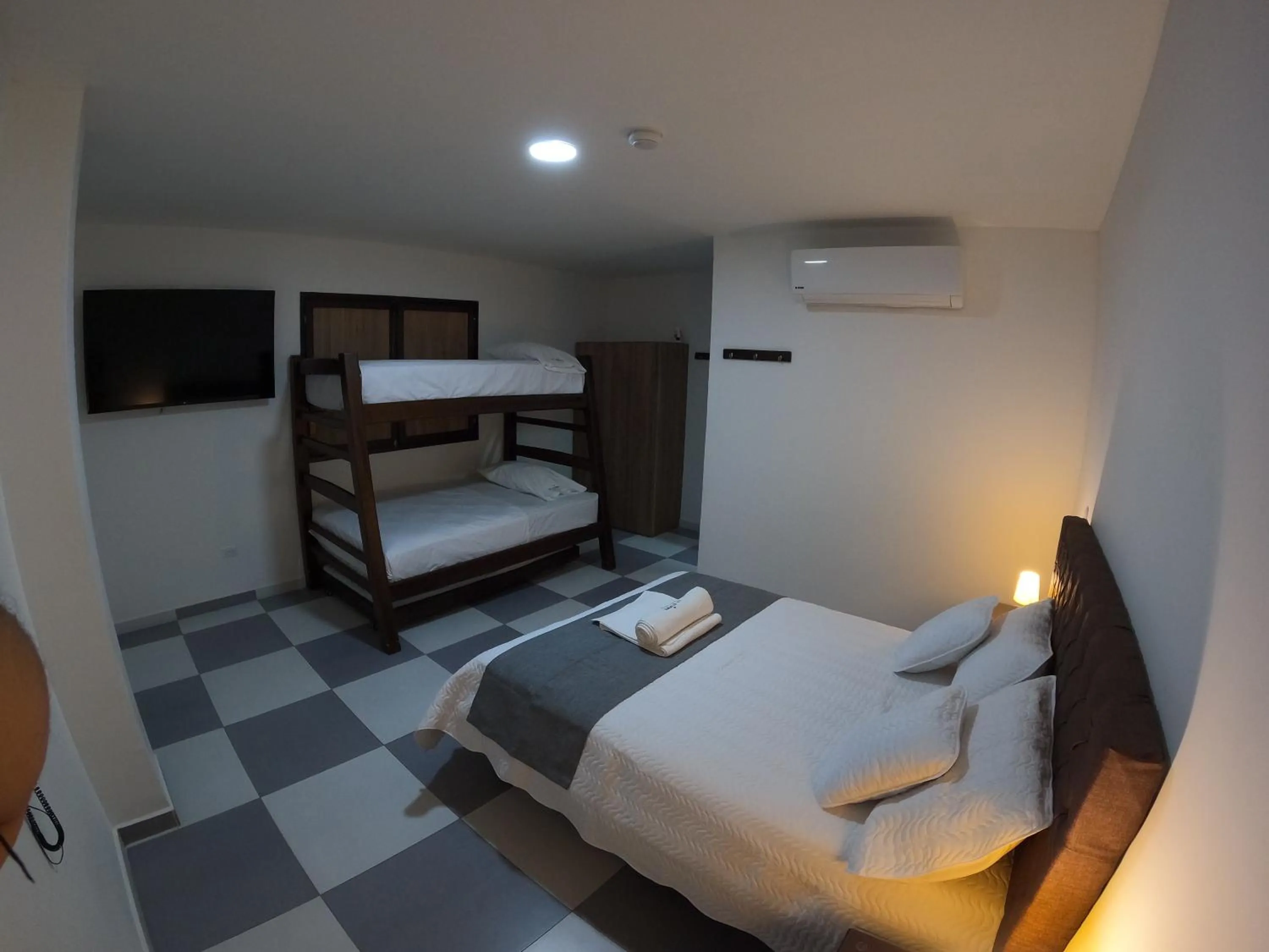 Communal lounge/ TV room, Bed in Hotel El Olimpo