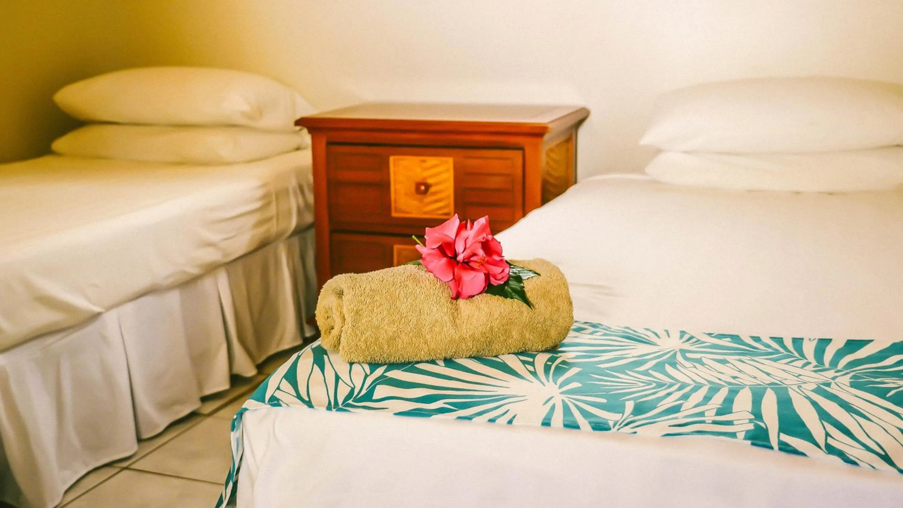 Patio, Bed in Muri Beach Resort