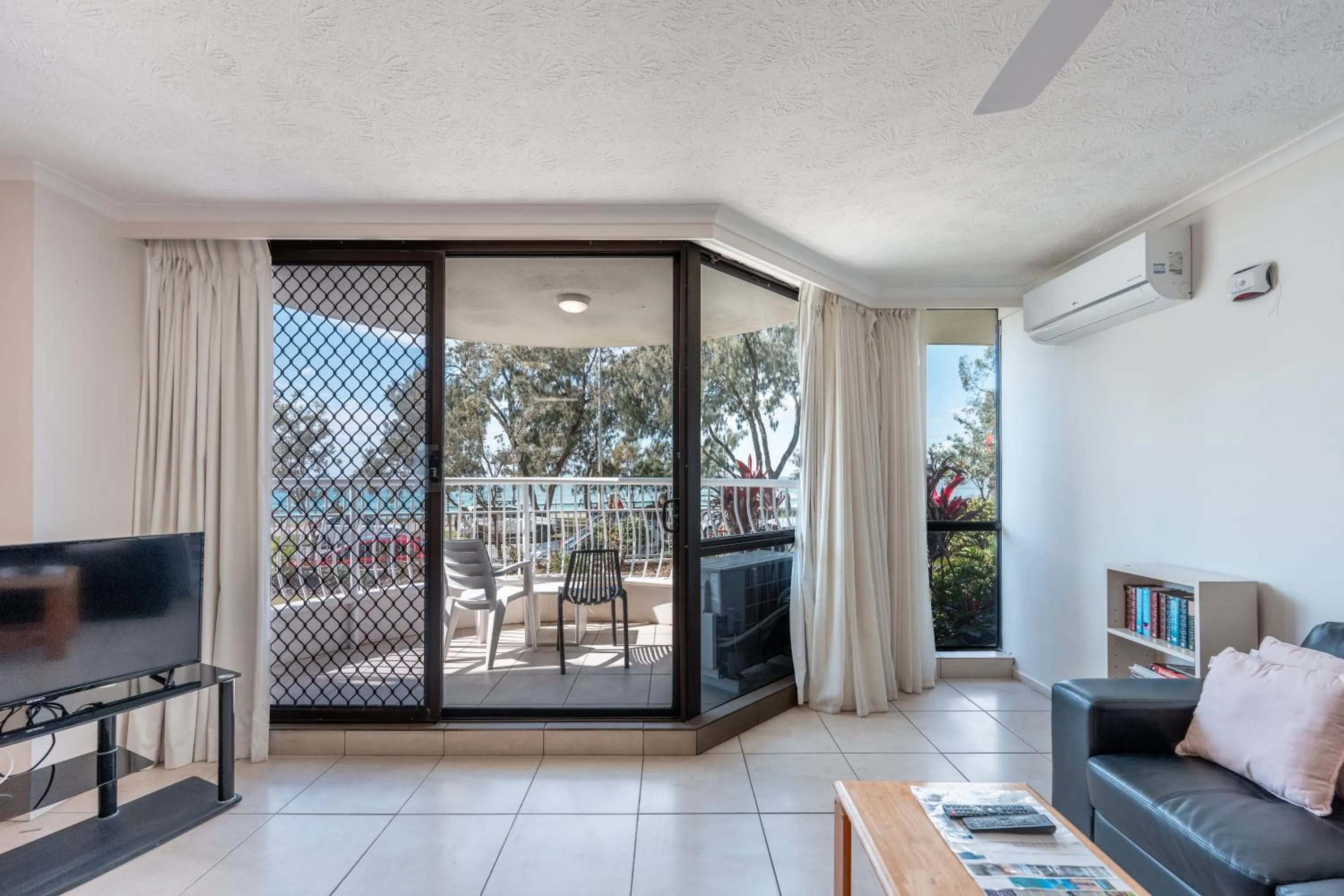 Living room in Olympus Beachfront Apartments