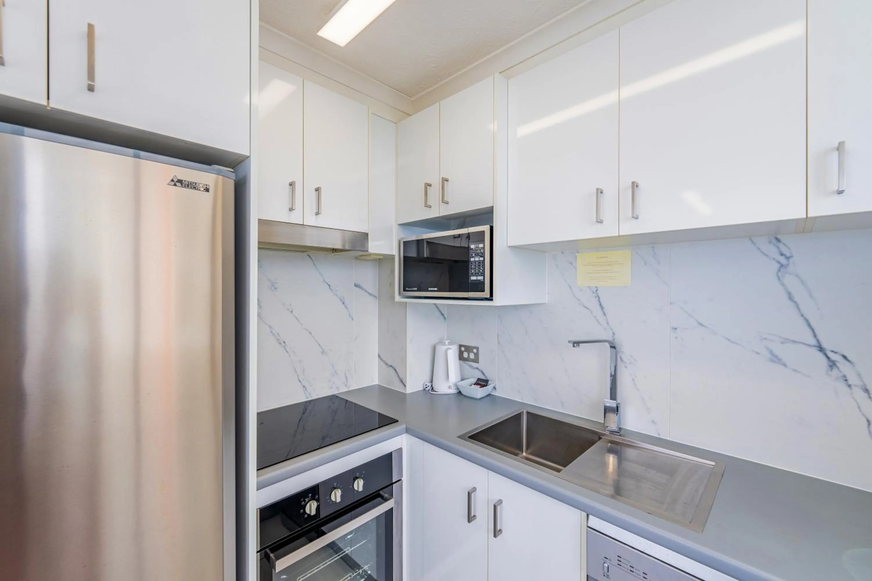 kitchen in Olympus Beachfront Apartments
