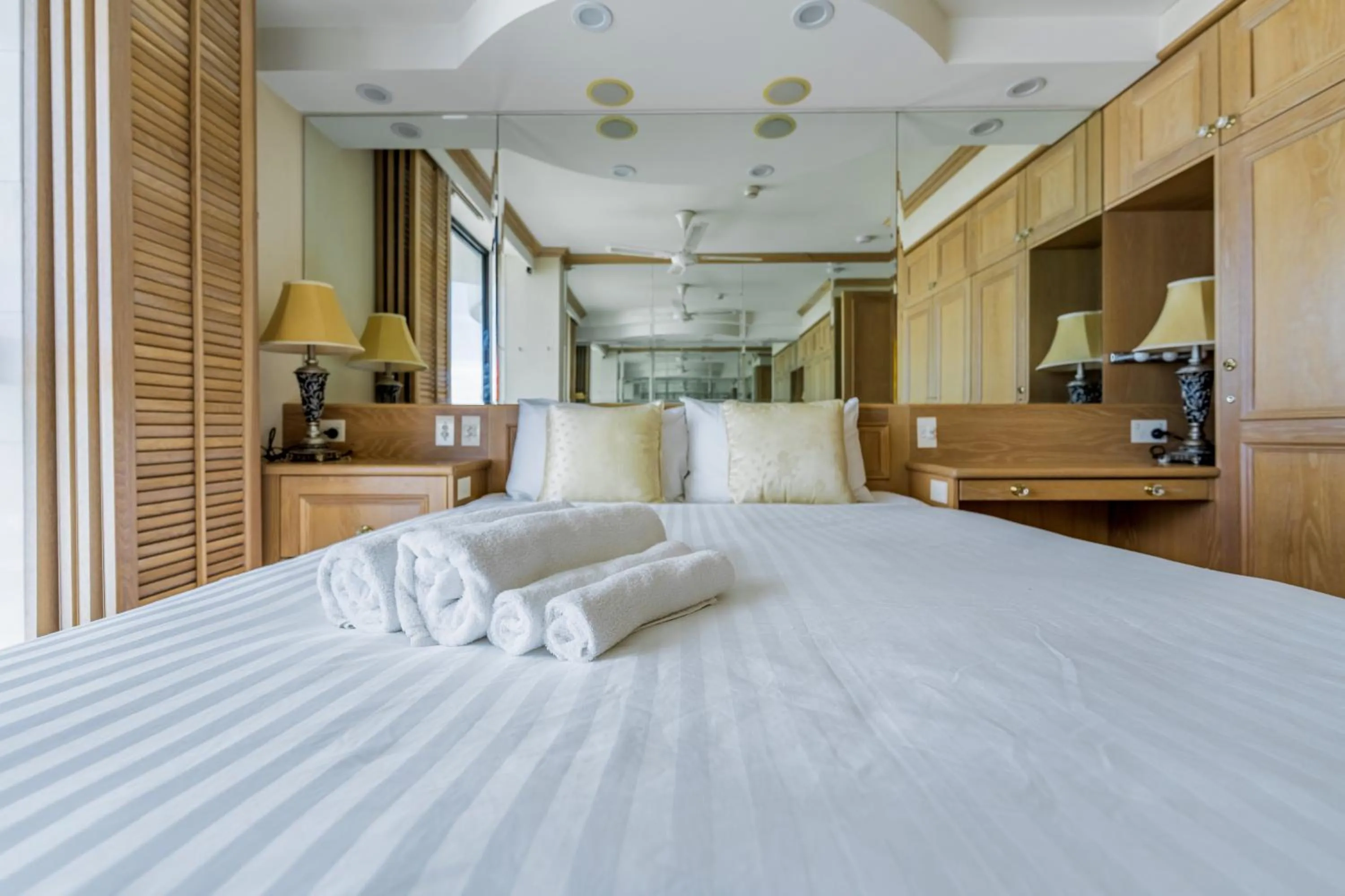 Bed in Olympus Beachfront Apartments