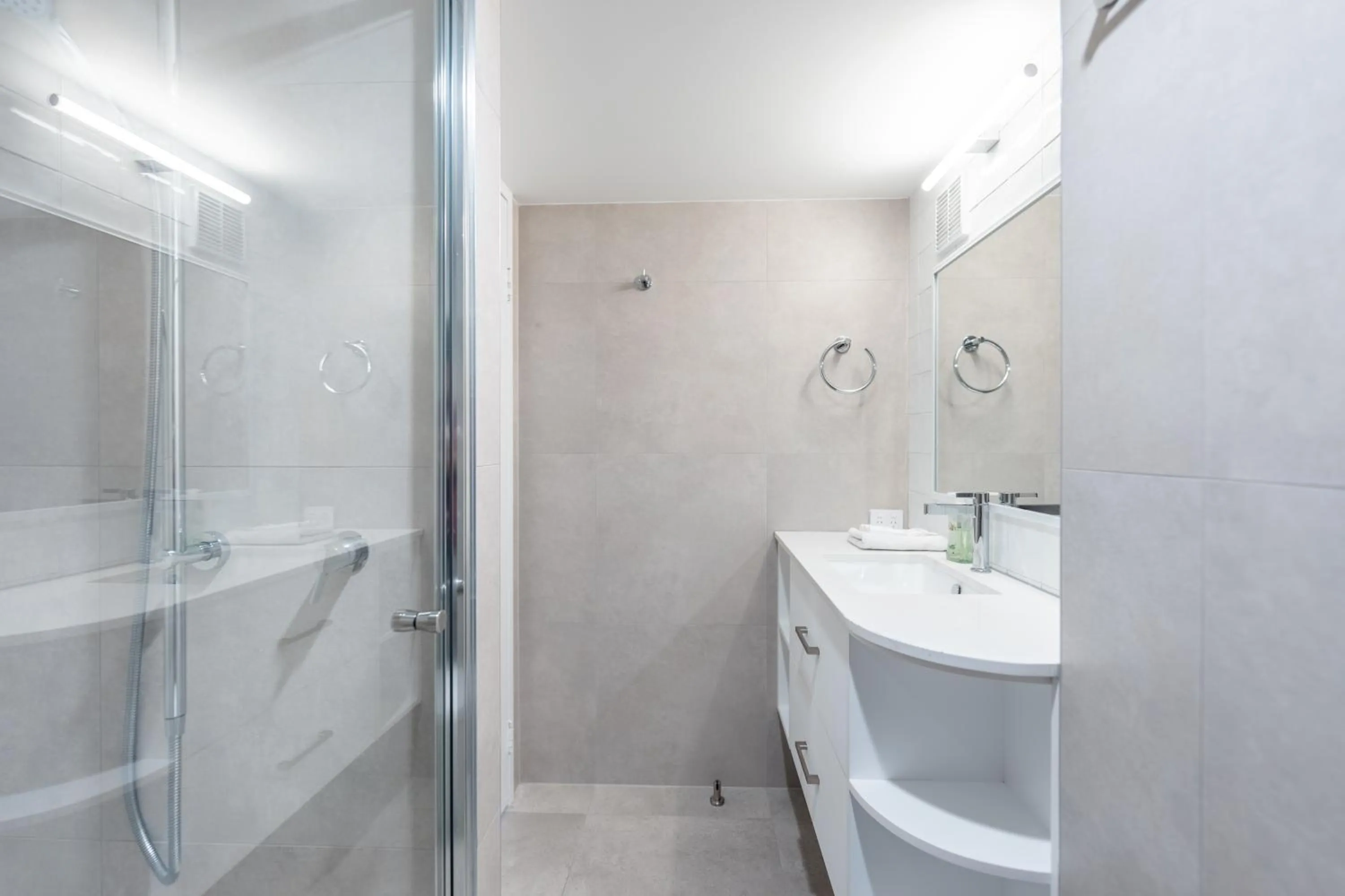Bathroom in Olympus Beachfront Apartments