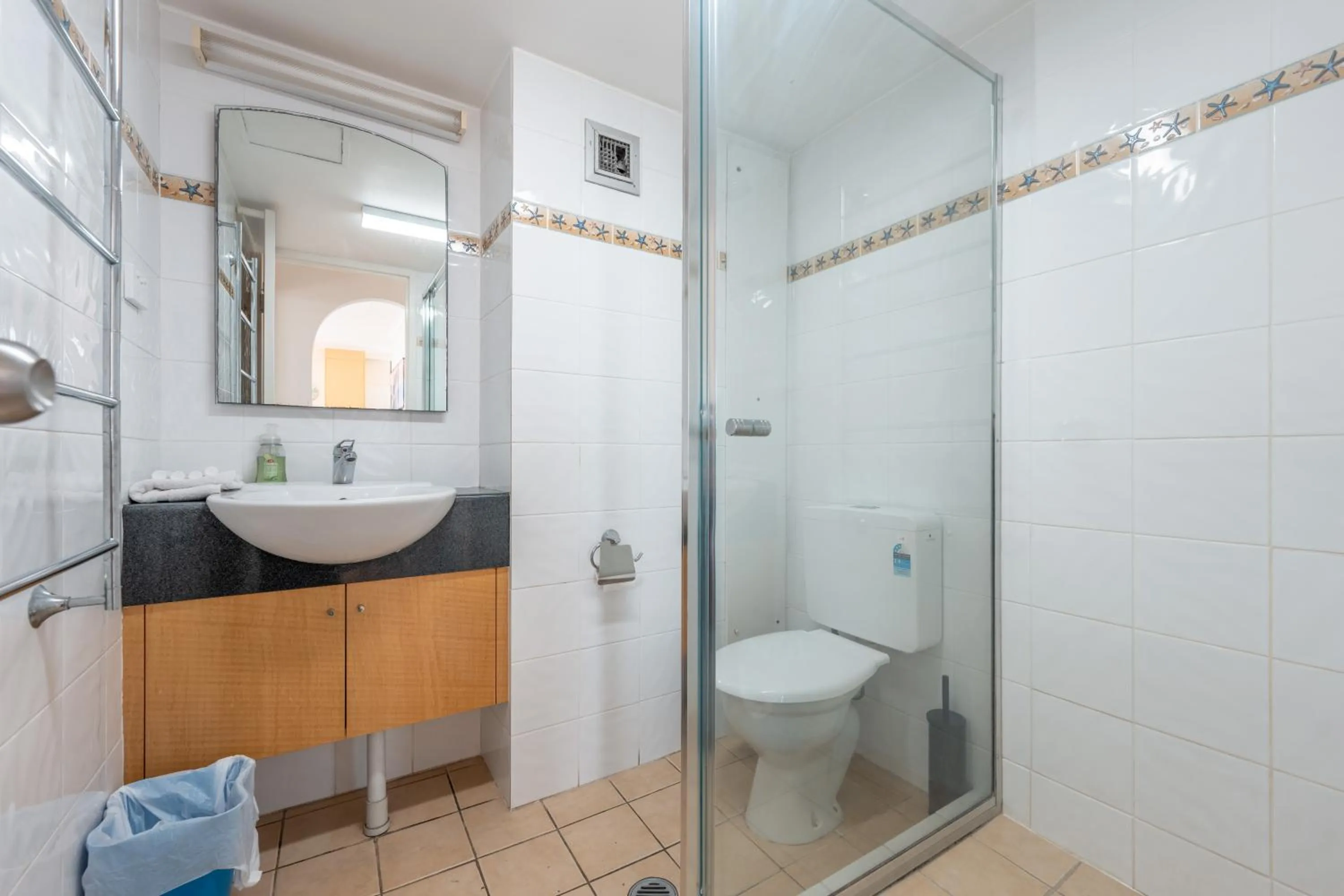 Bathroom in Olympus Beachfront Apartments