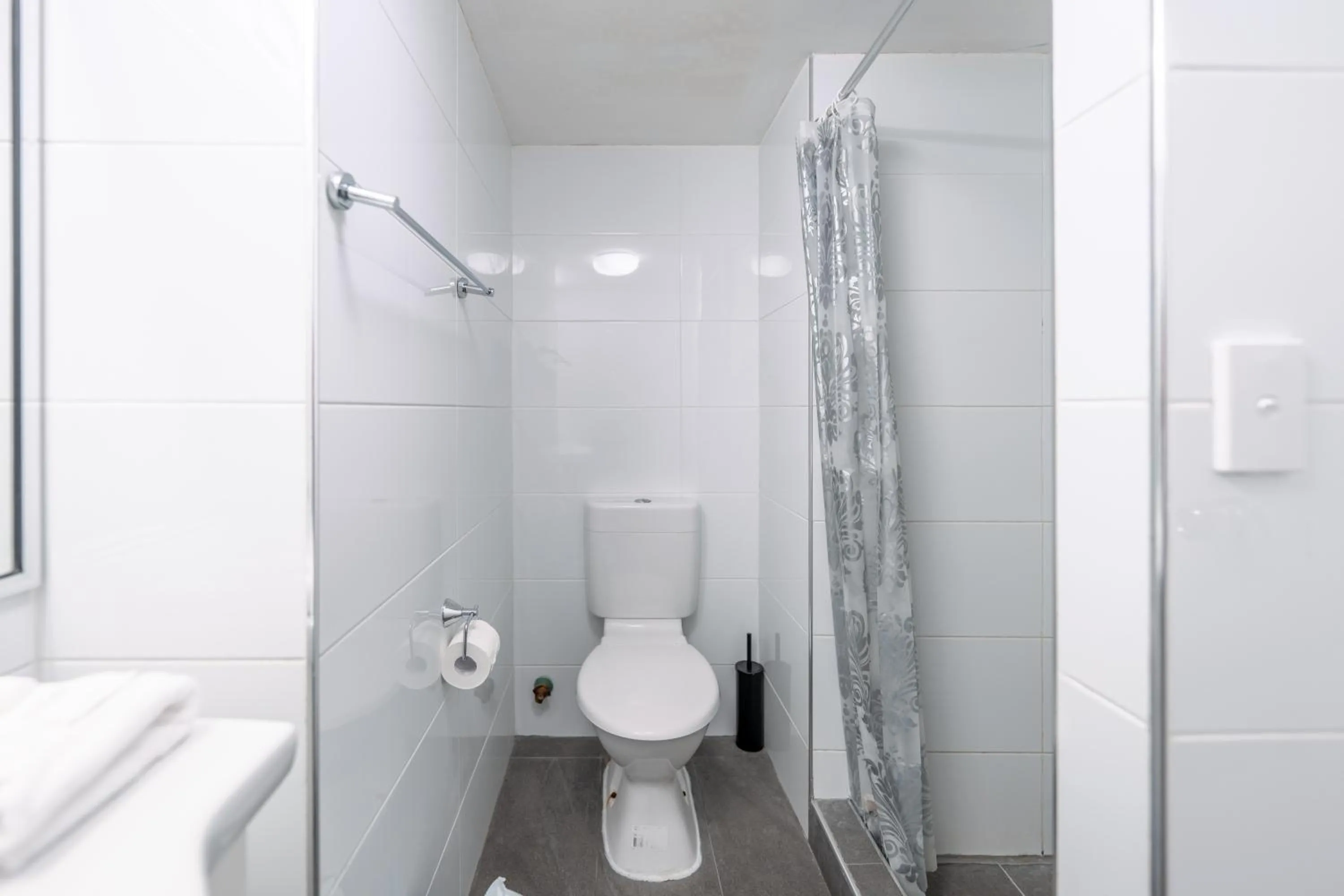 Bathroom in Olympus Beachfront Apartments