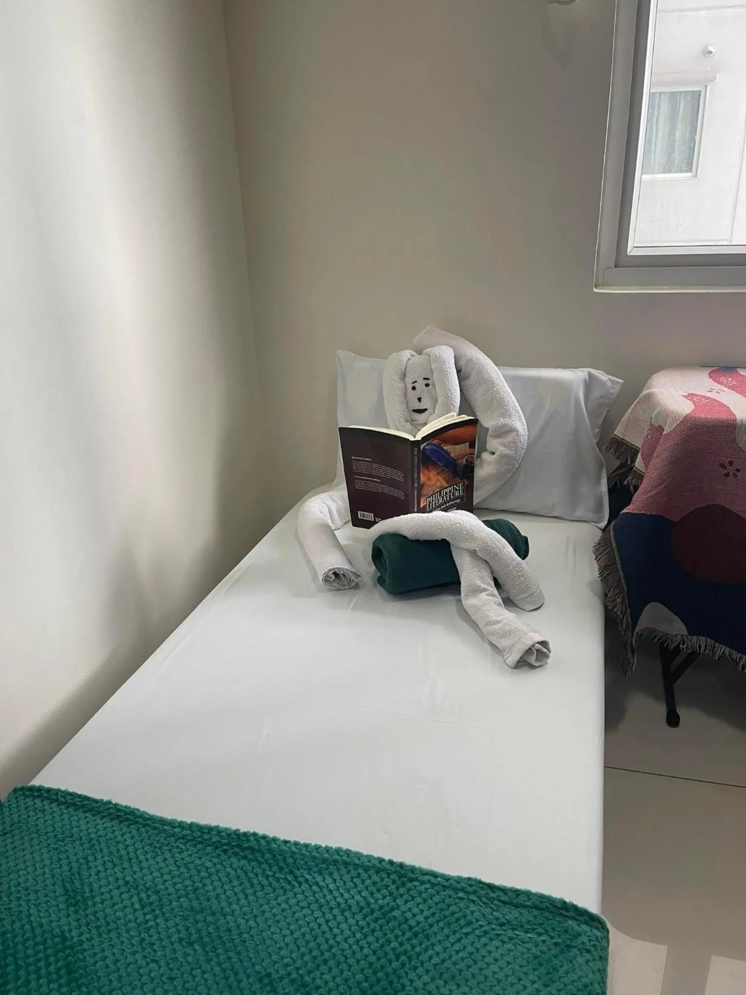 Bed in Green Residences Stays by PBYY