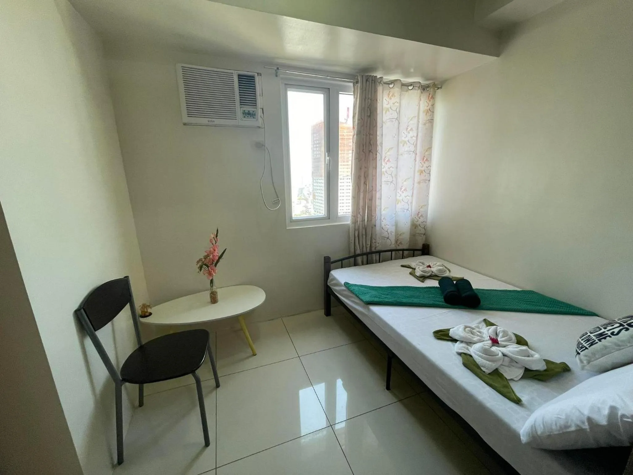 Bed in Green Residences Stays by PBYY