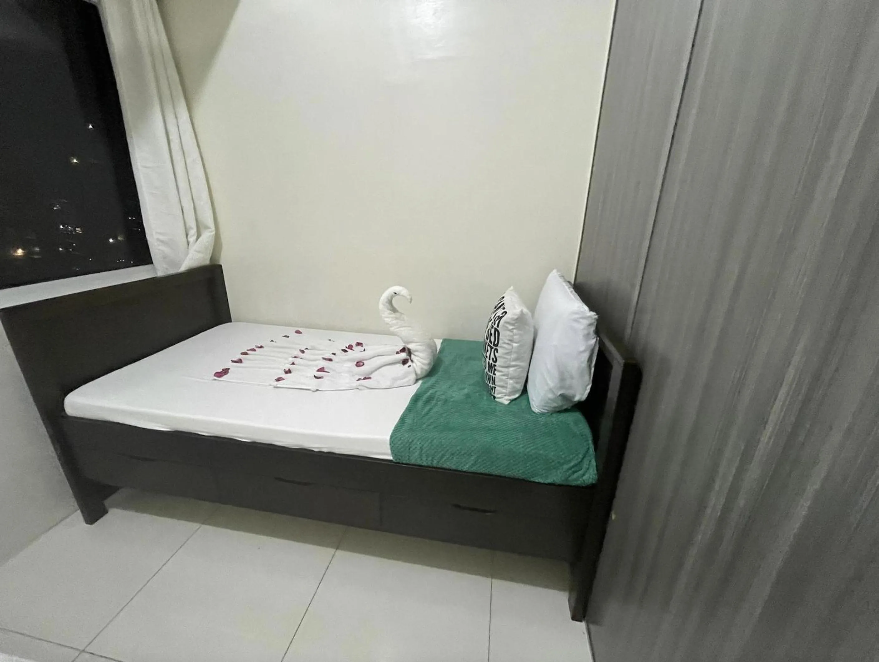 Bed in Green Residences Stays by PBYY