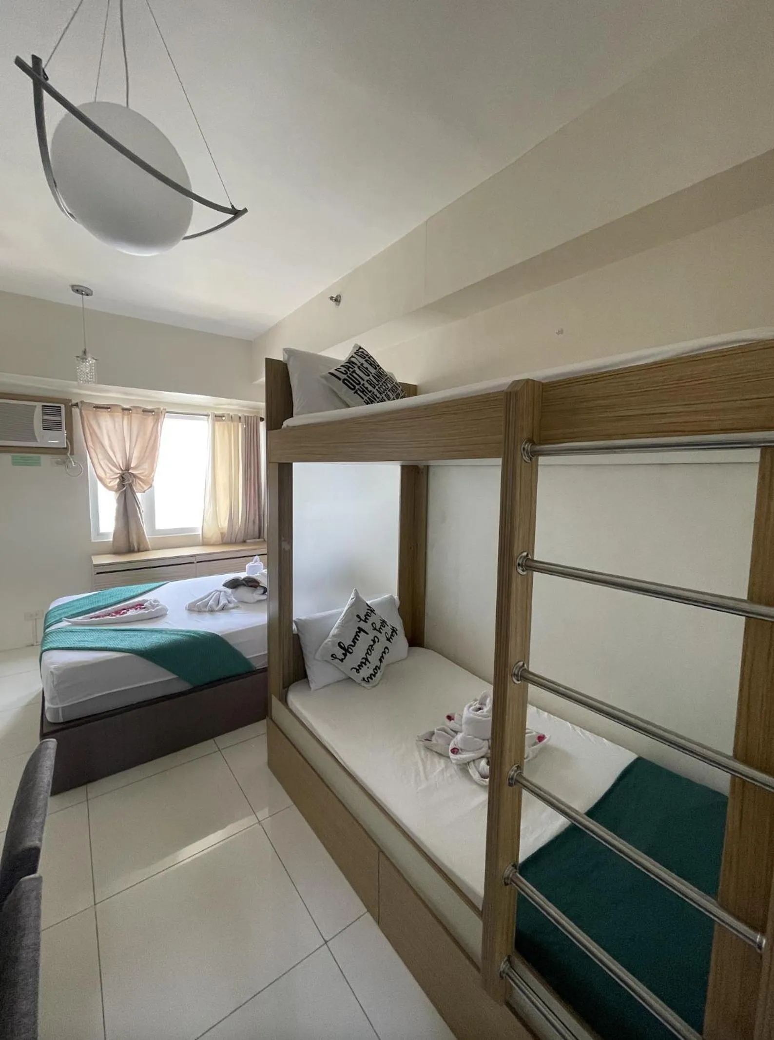 Bed in Green Residences Stays by PBYY