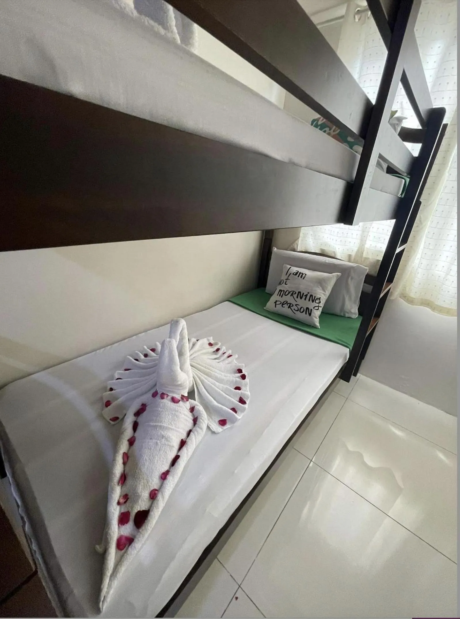 Bed in Green Residences Stays by PBYY