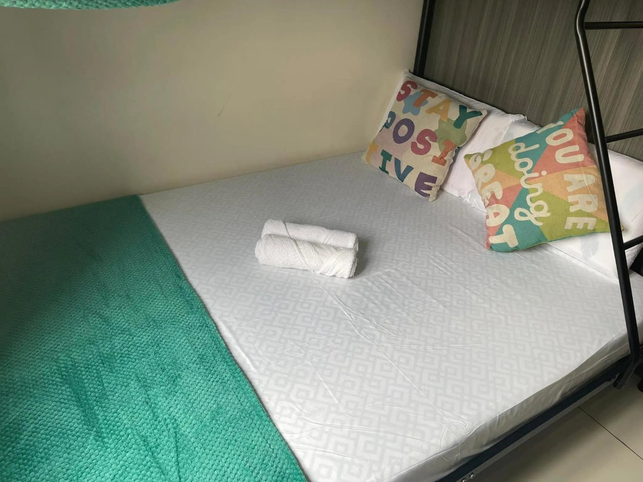 Bed in Green Residences Stays by PBYY