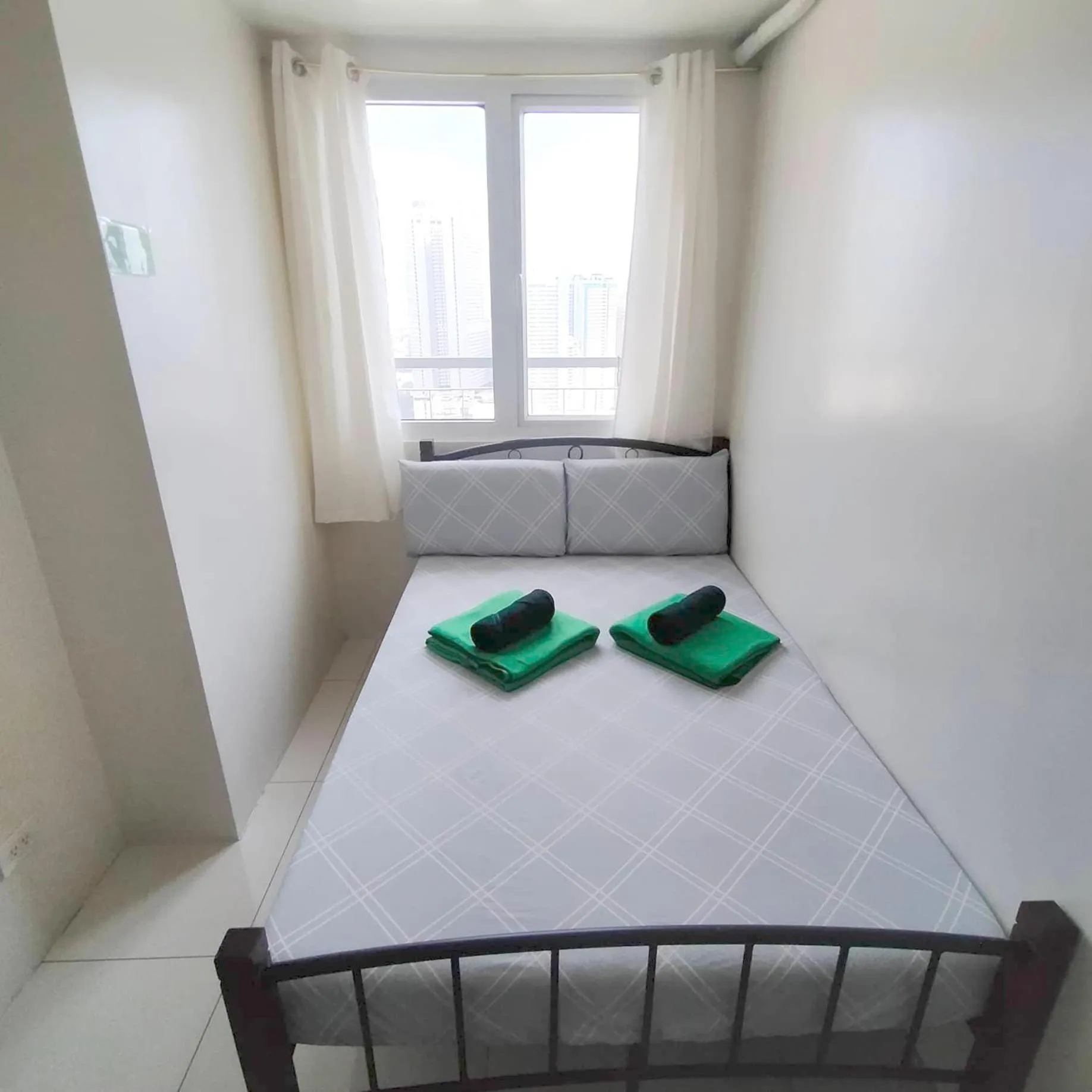 Bed in Green Residences Stays by PBYY