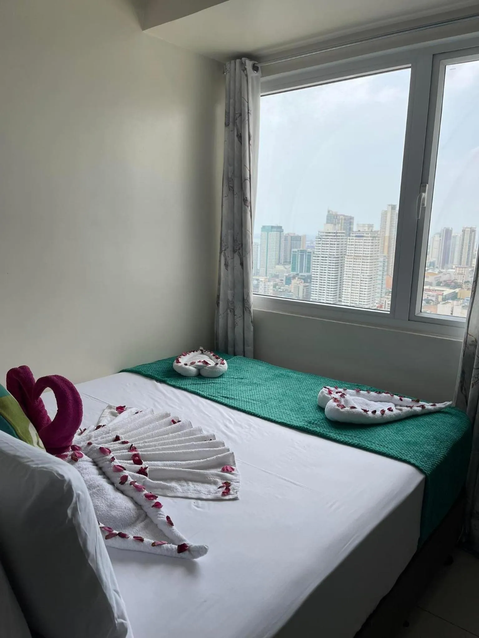 Bed in Green Residences Stays by PBYY