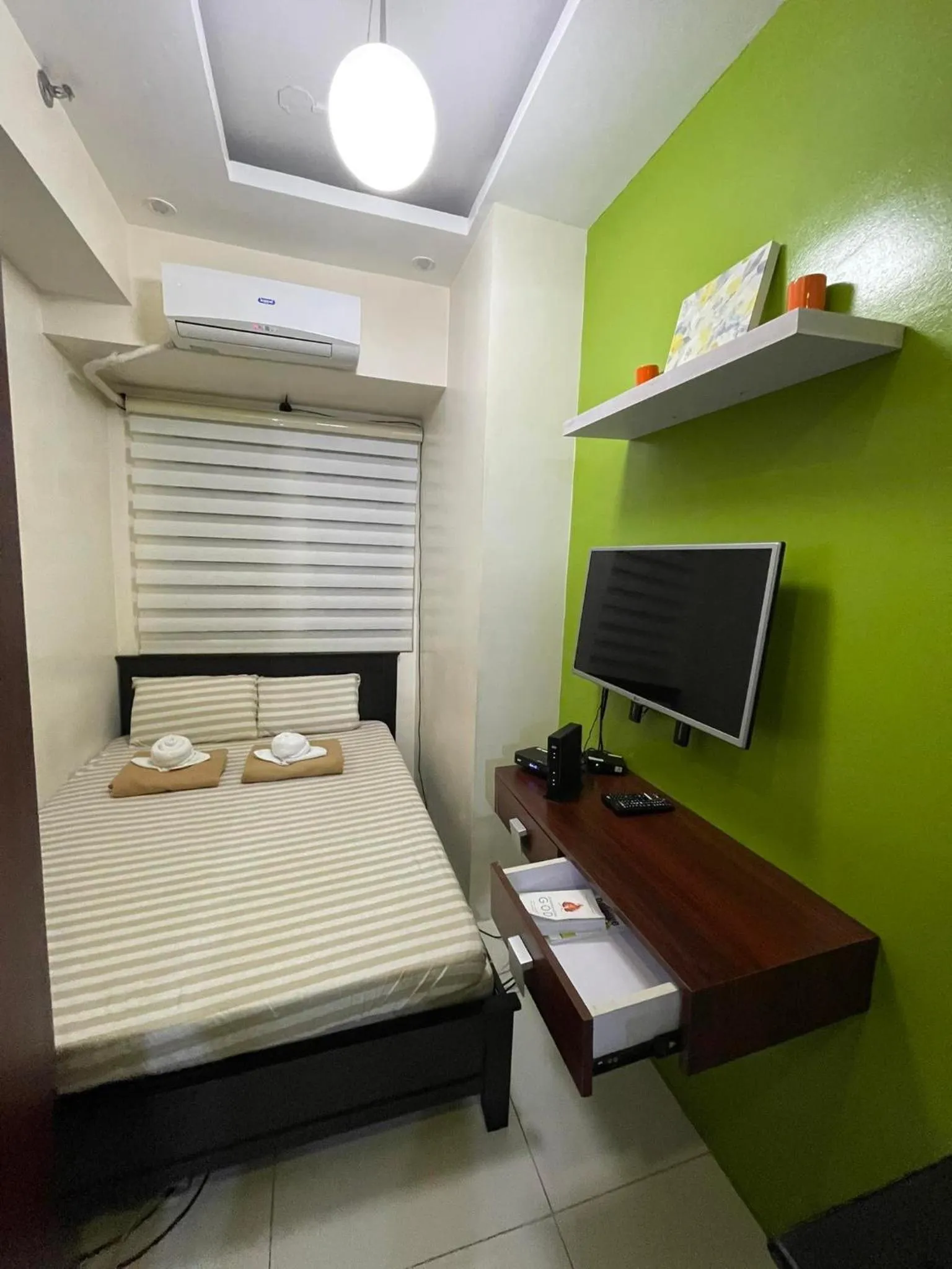 Bed in Green Residences Stays by PBYY