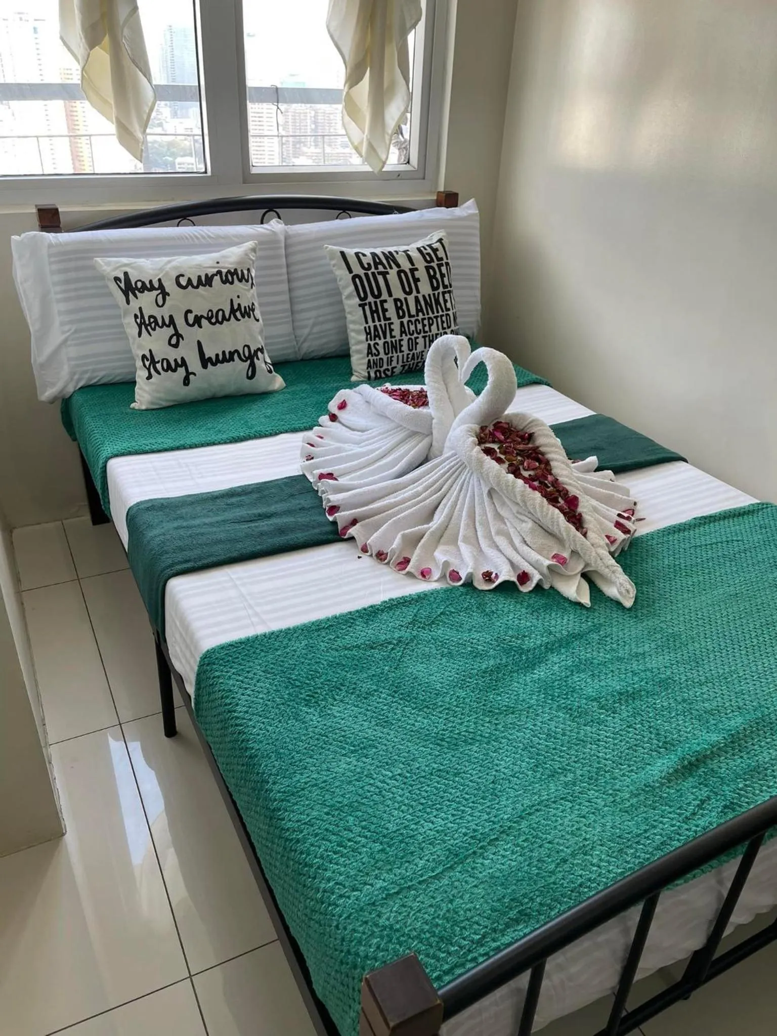 Bed in Green Residences Stays by PBYY