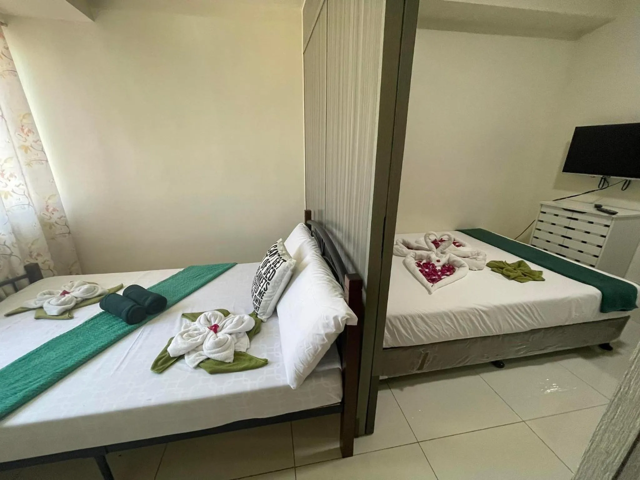 Bed in Green Residences Stays by PBYY