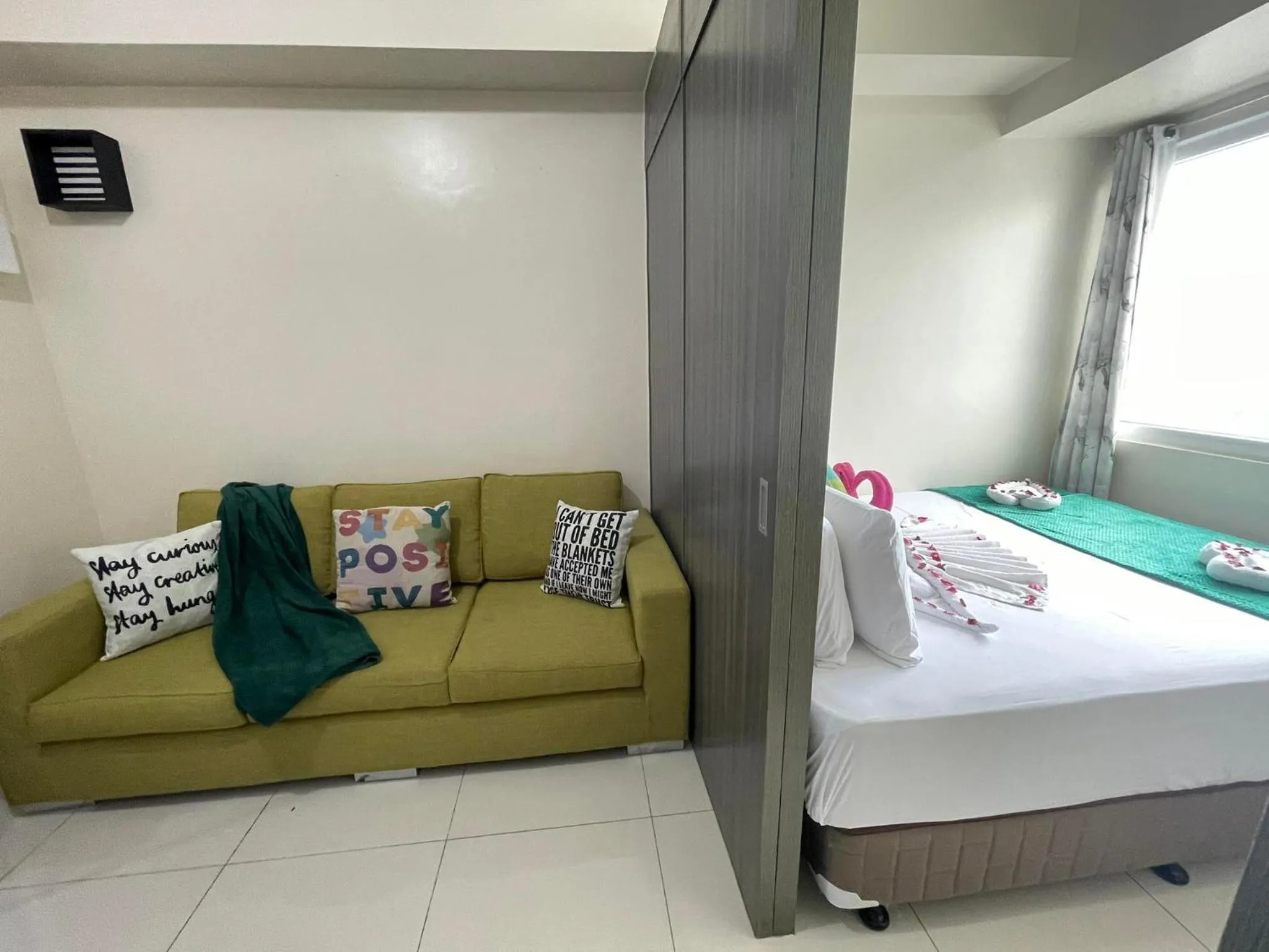 Bed in Green Residences Stays by PBYY