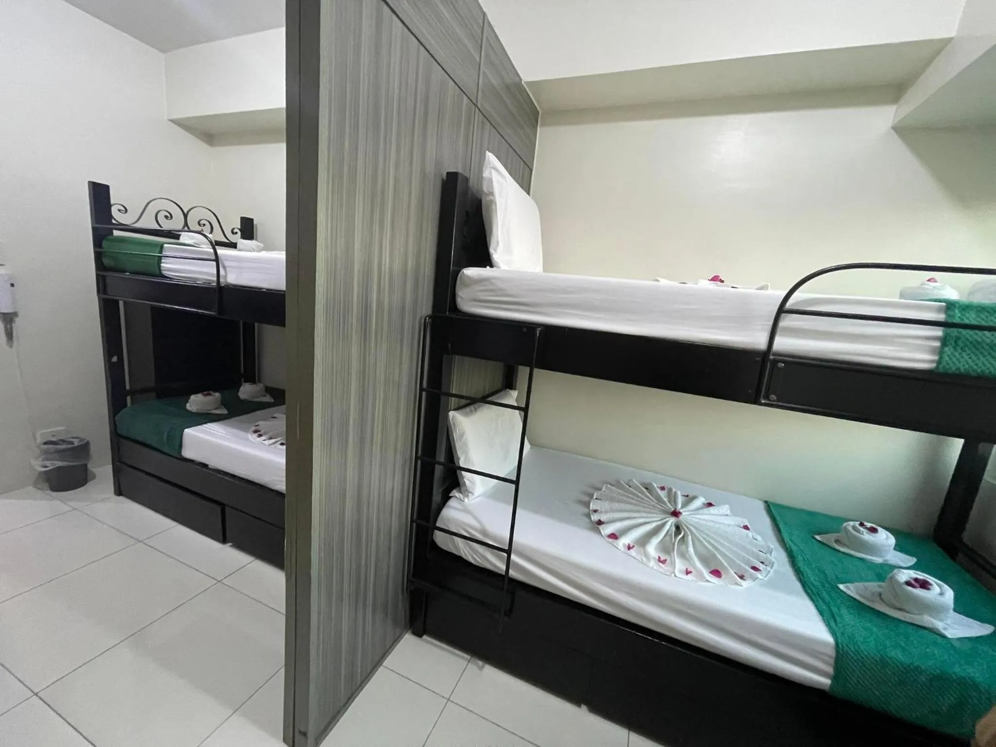 Bed in Green Residences Stays by PBYY