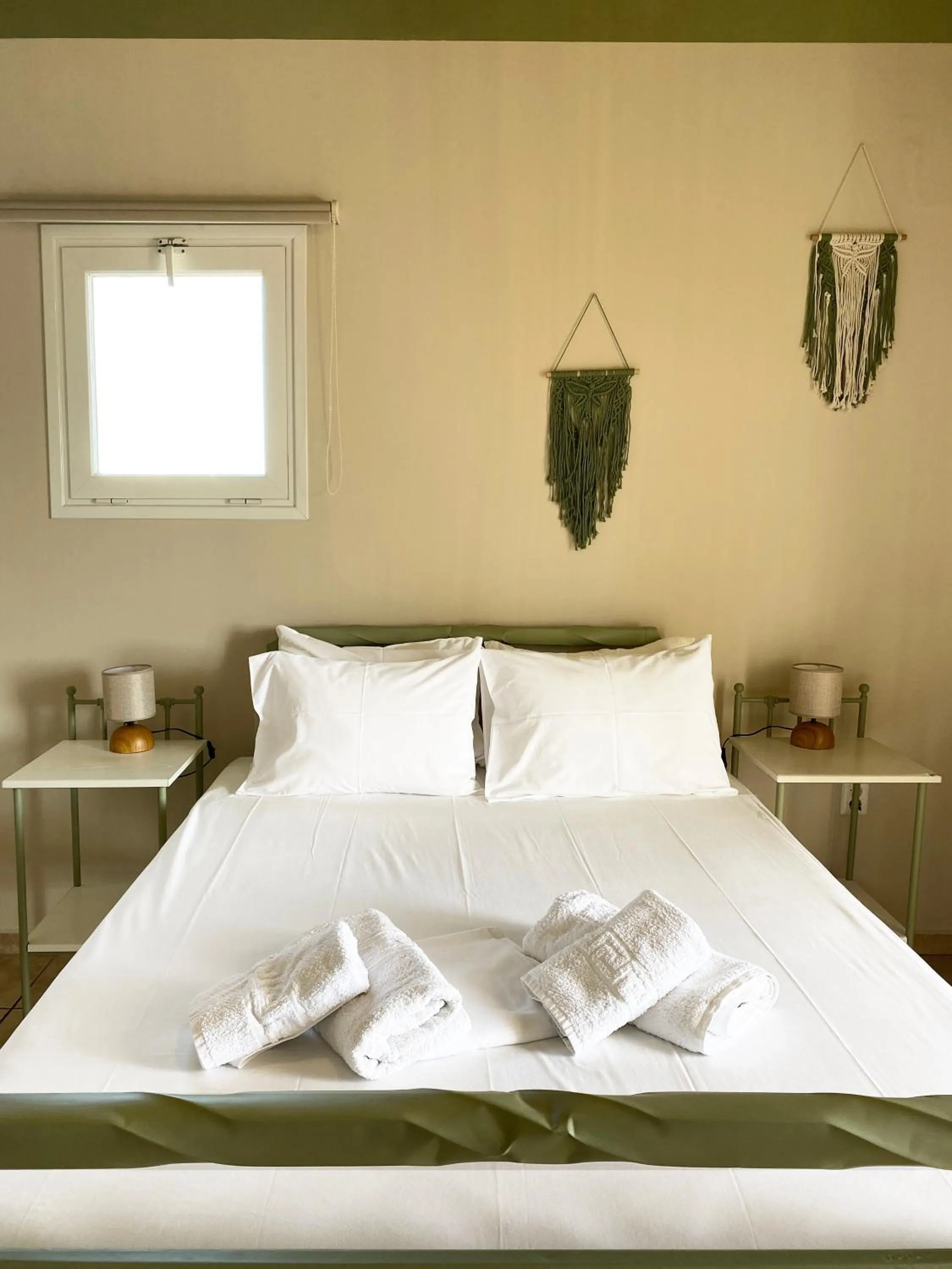 Bed in Agnadi Syros Beachfront Studios & Rooms