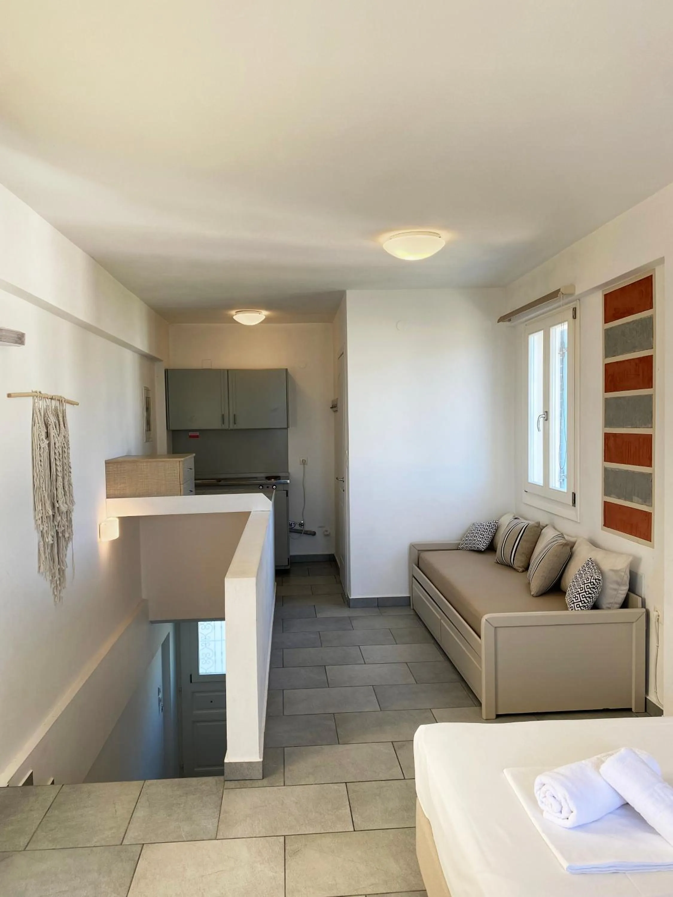 Kitchen or kitchenette in Agnadi Syros Beachfront Studios & Rooms