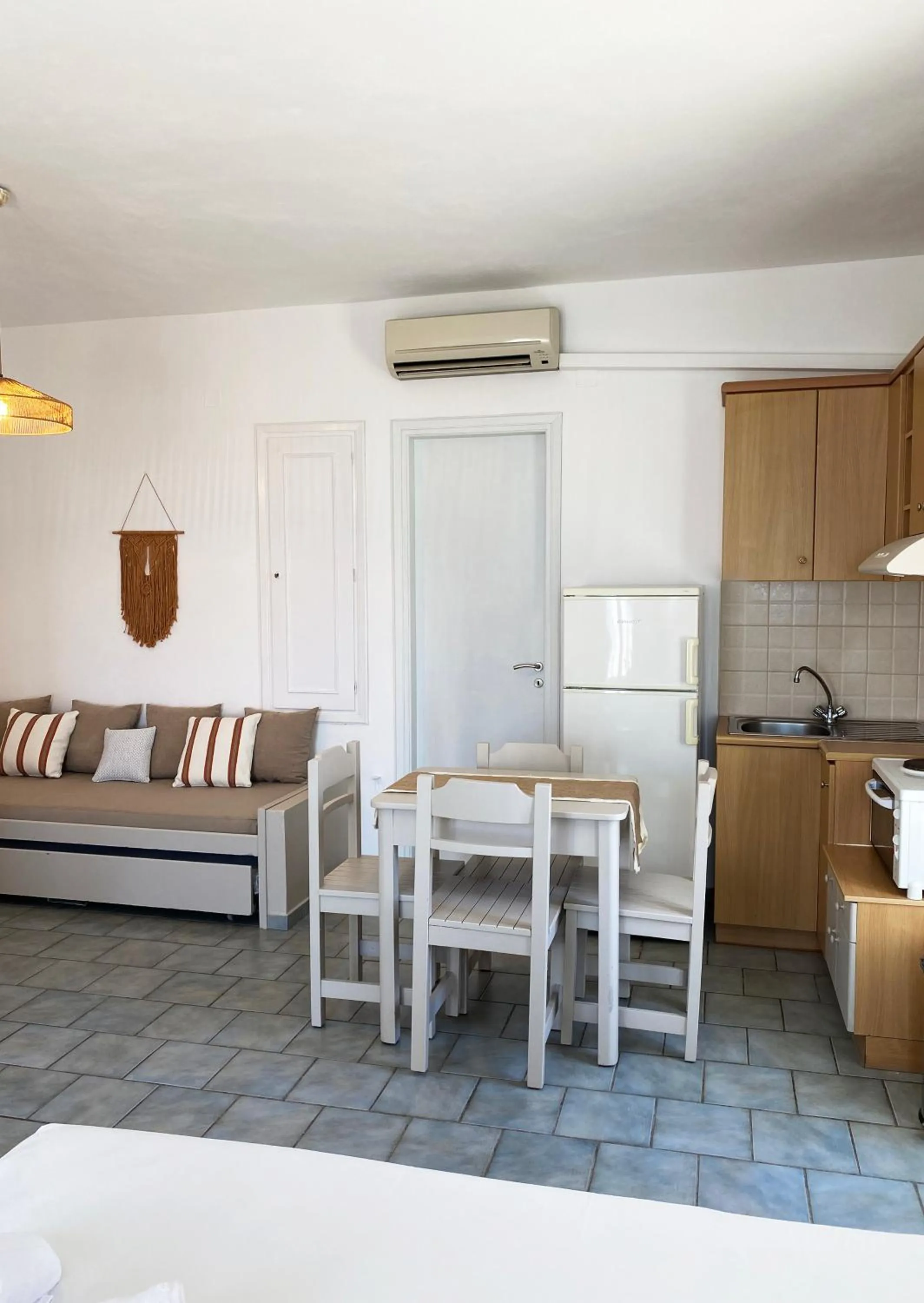 Kitchen or kitchenette in Agnadi Syros Beachfront Studios & Rooms
