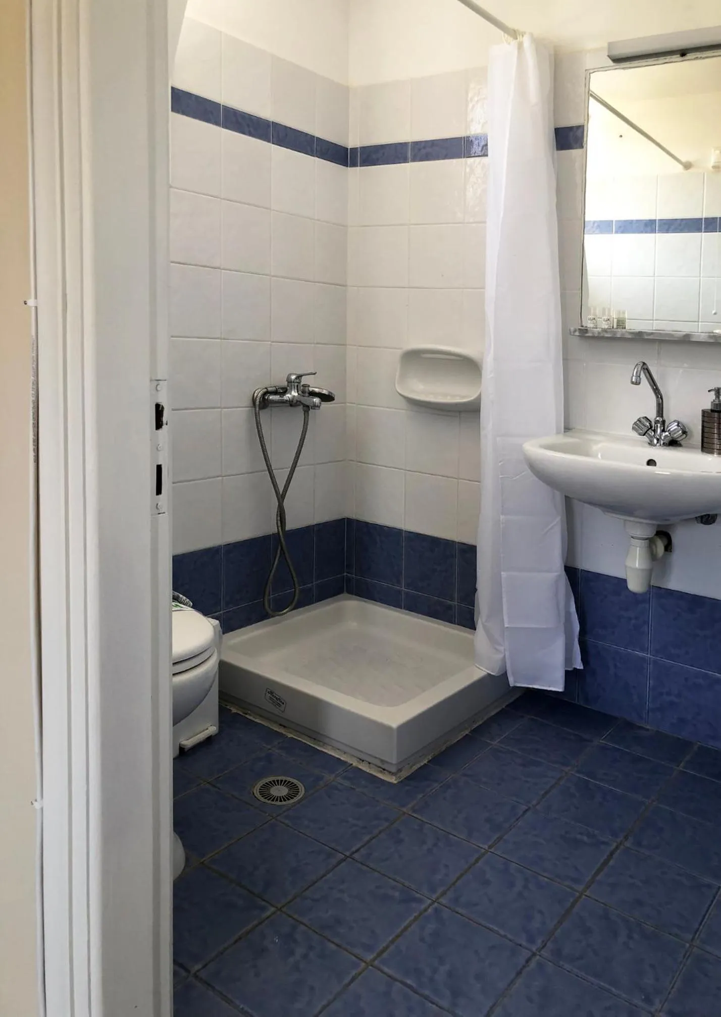 Shower in Agnadi Syros Beachfront Studios & Rooms