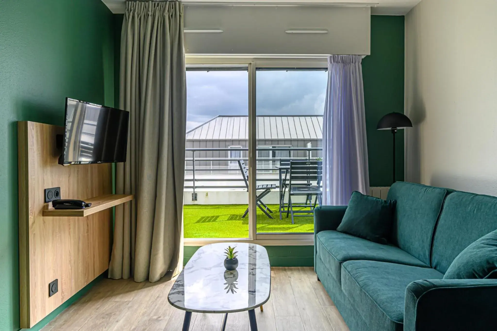 Living room in Appart Hôtel Le Liberté Vannes Centre-Ville Living room in Appart Hôtel Le Liberté Vannes Centre-Ville