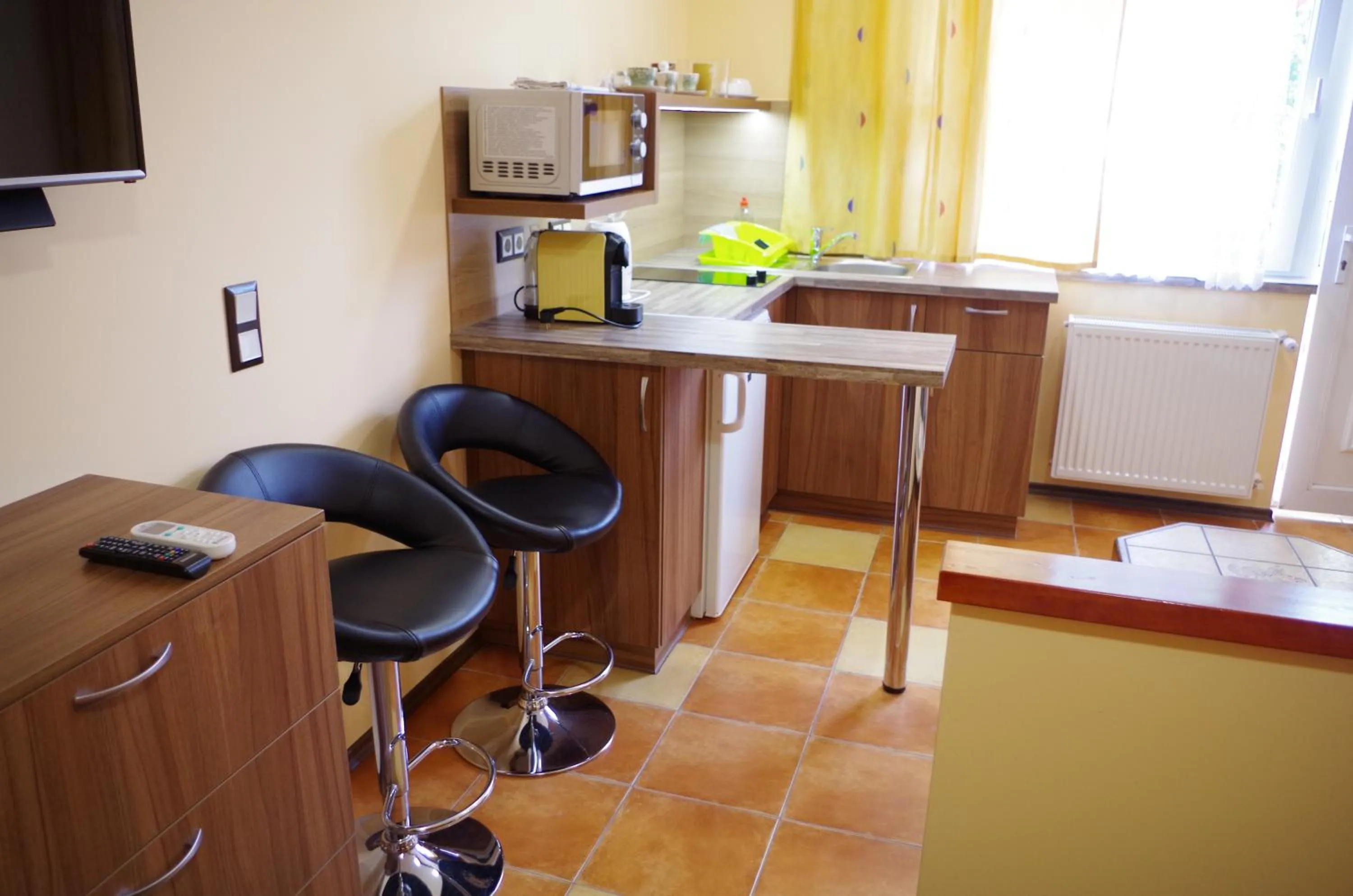 Kitchen or kitchenette in Aranyhal Apartman
