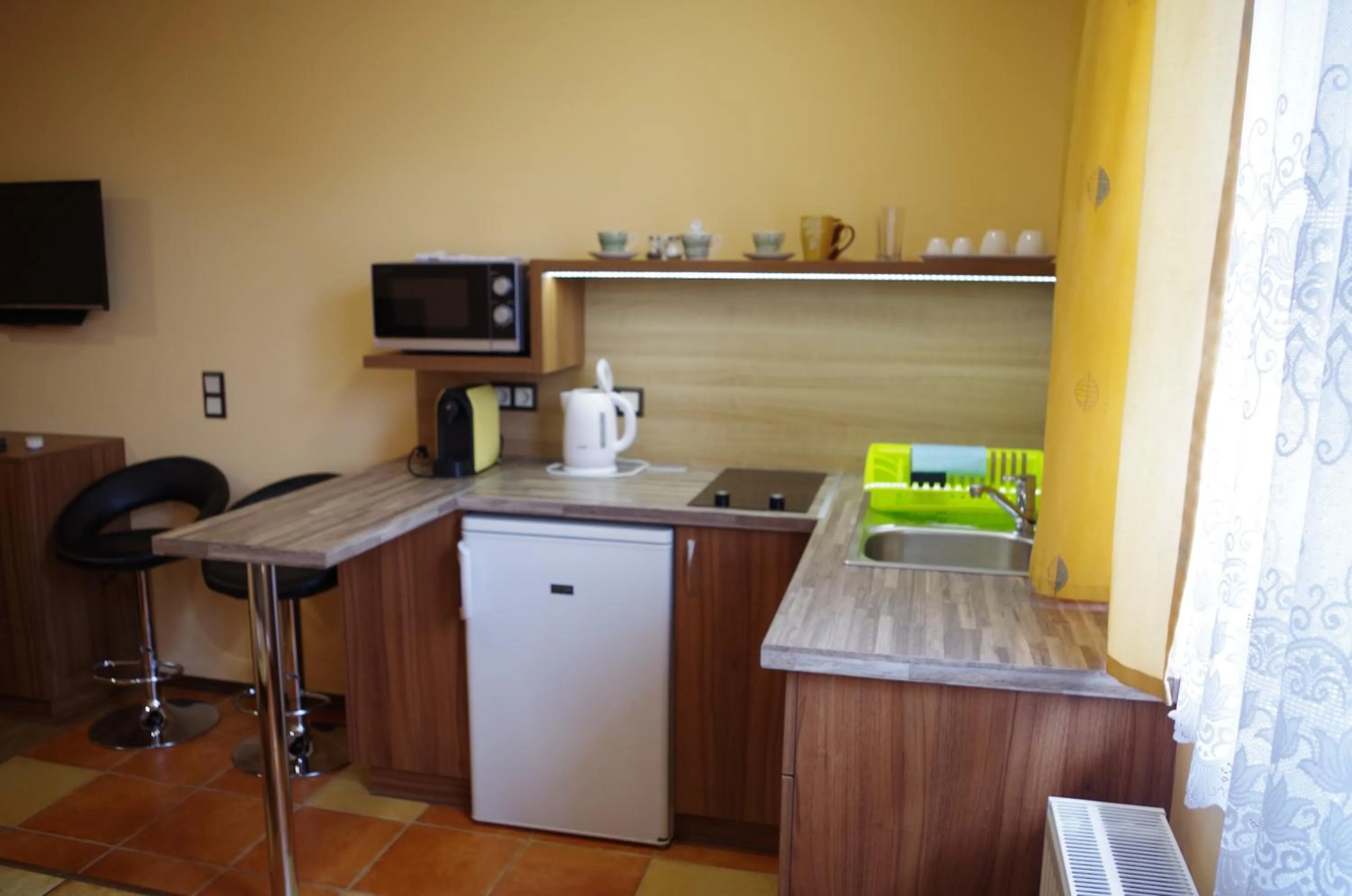 Kitchen or kitchenette in Aranyhal Apartman