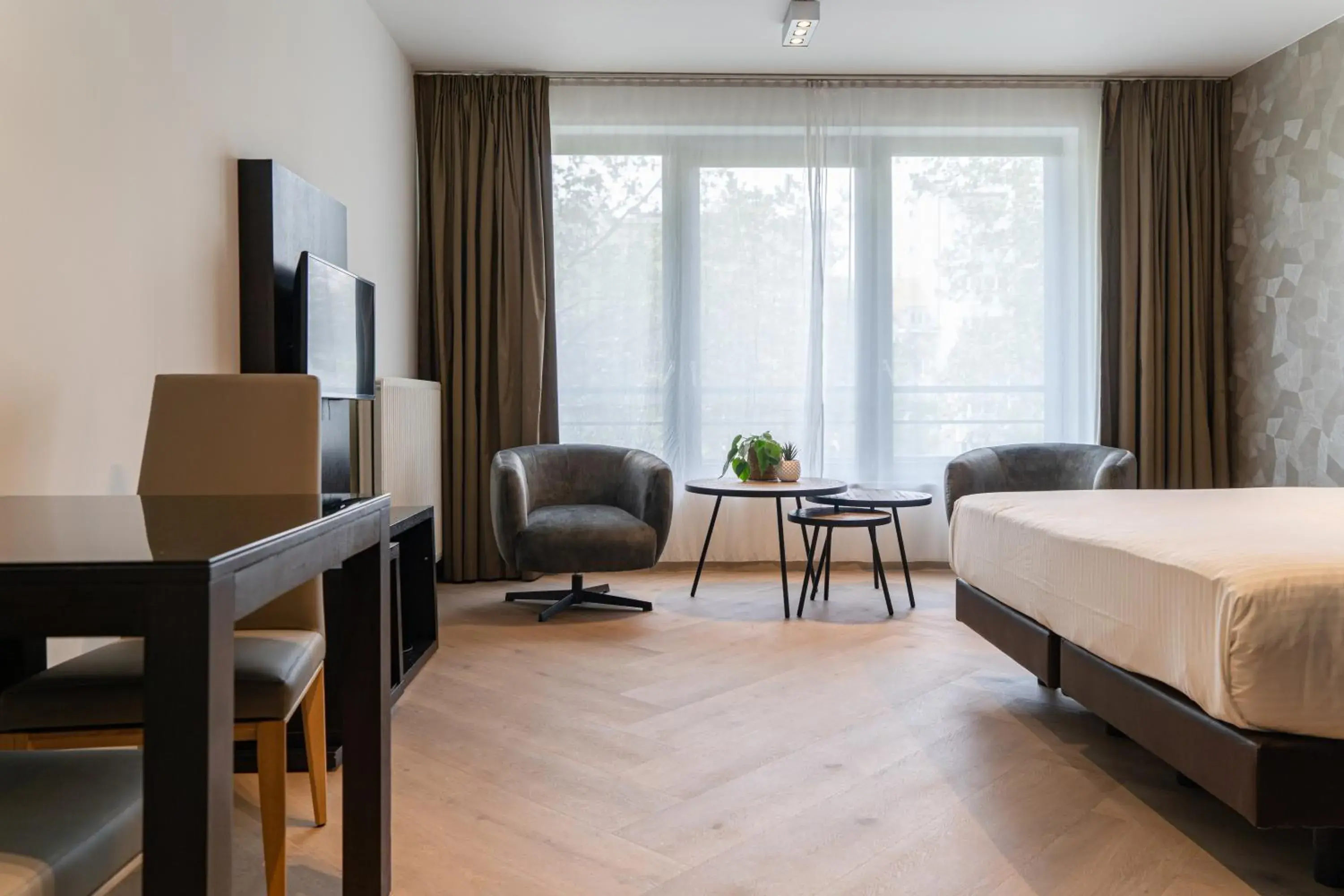 Living room, Bed in Diamant Suites Brussels EU Living room, Bed in Diamant Suites Brussels EU