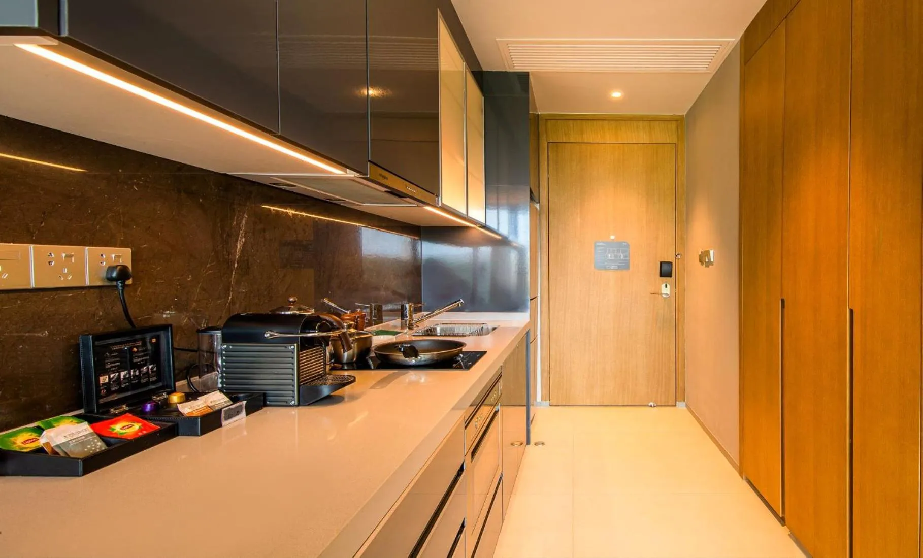 Kitchen or kitchenette in Oakwood Apartments Sanya