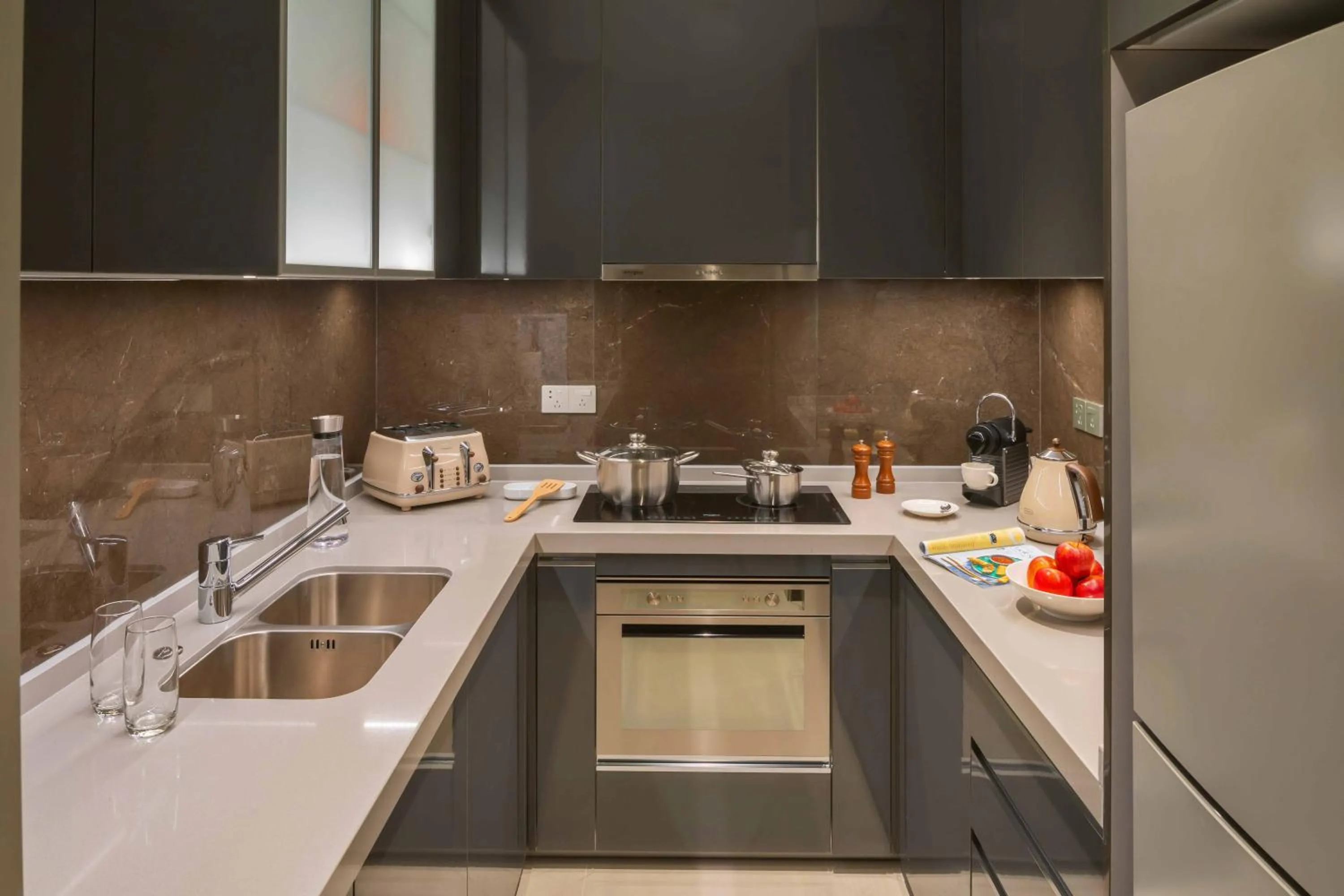 Kitchen or kitchenette in Oakwood Apartments Sanya