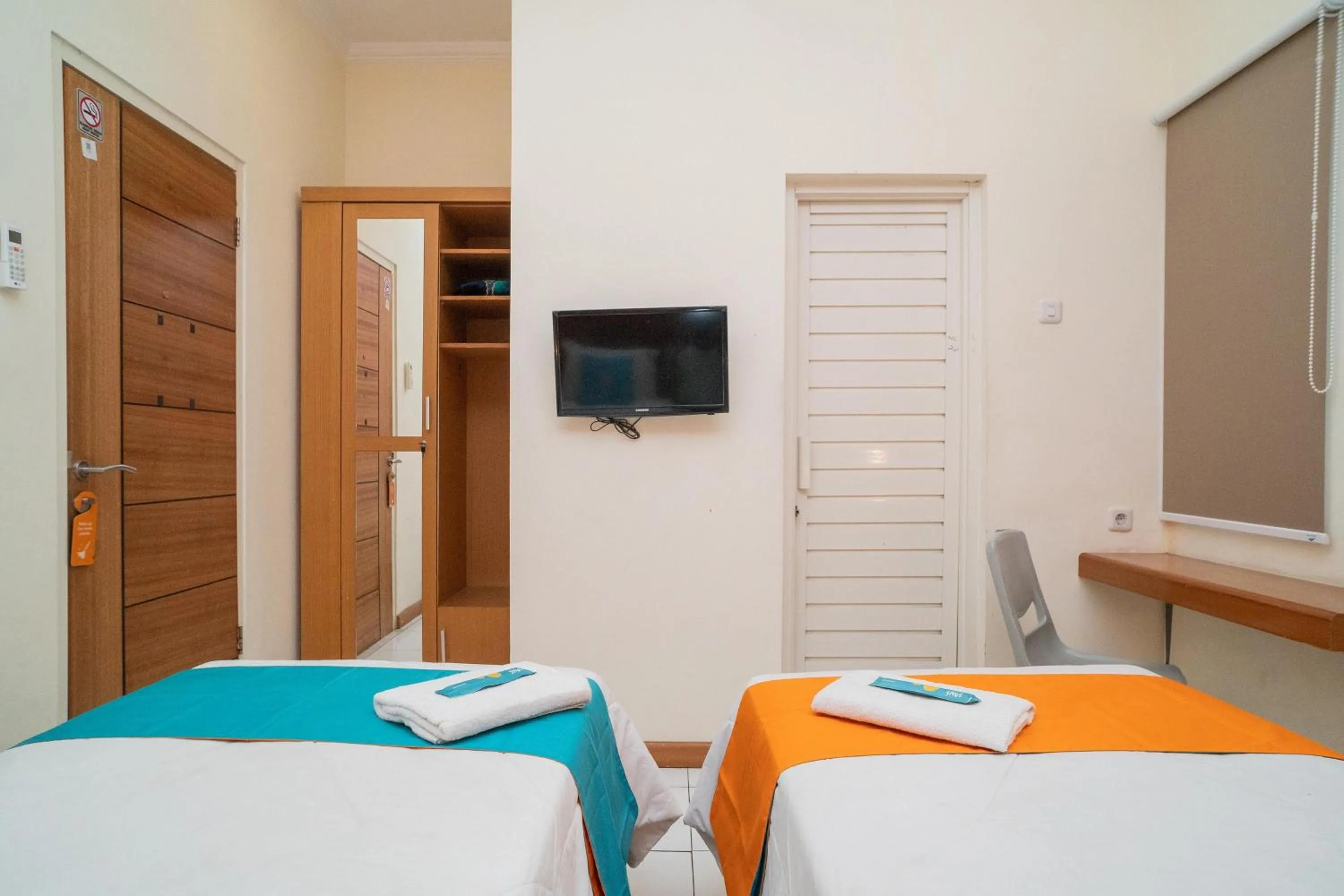 Bed in Sans Hotel FiFFa Pisang Kipas Malang