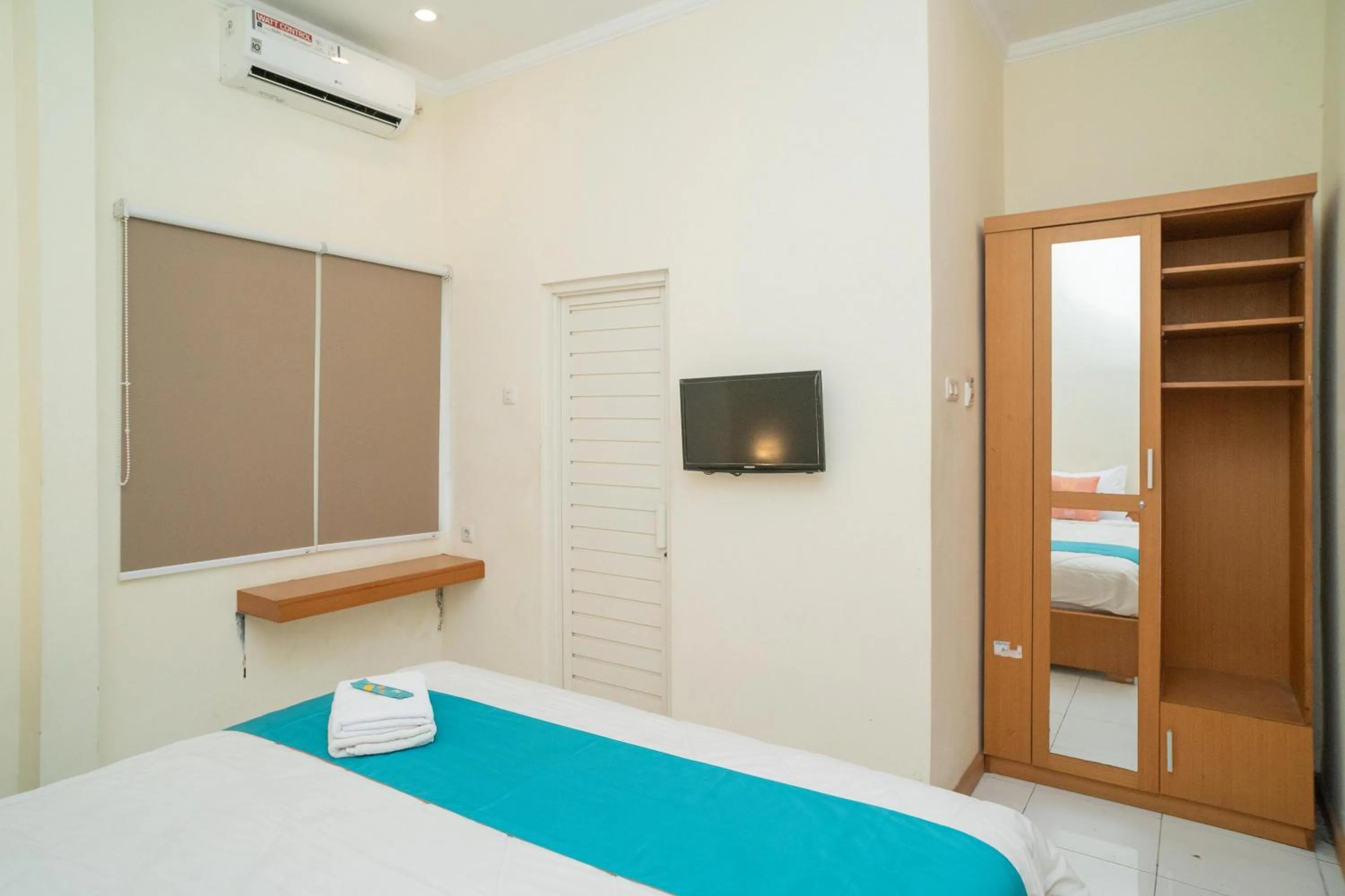 Bed in Sans Hotel FiFFa Pisang Kipas Malang