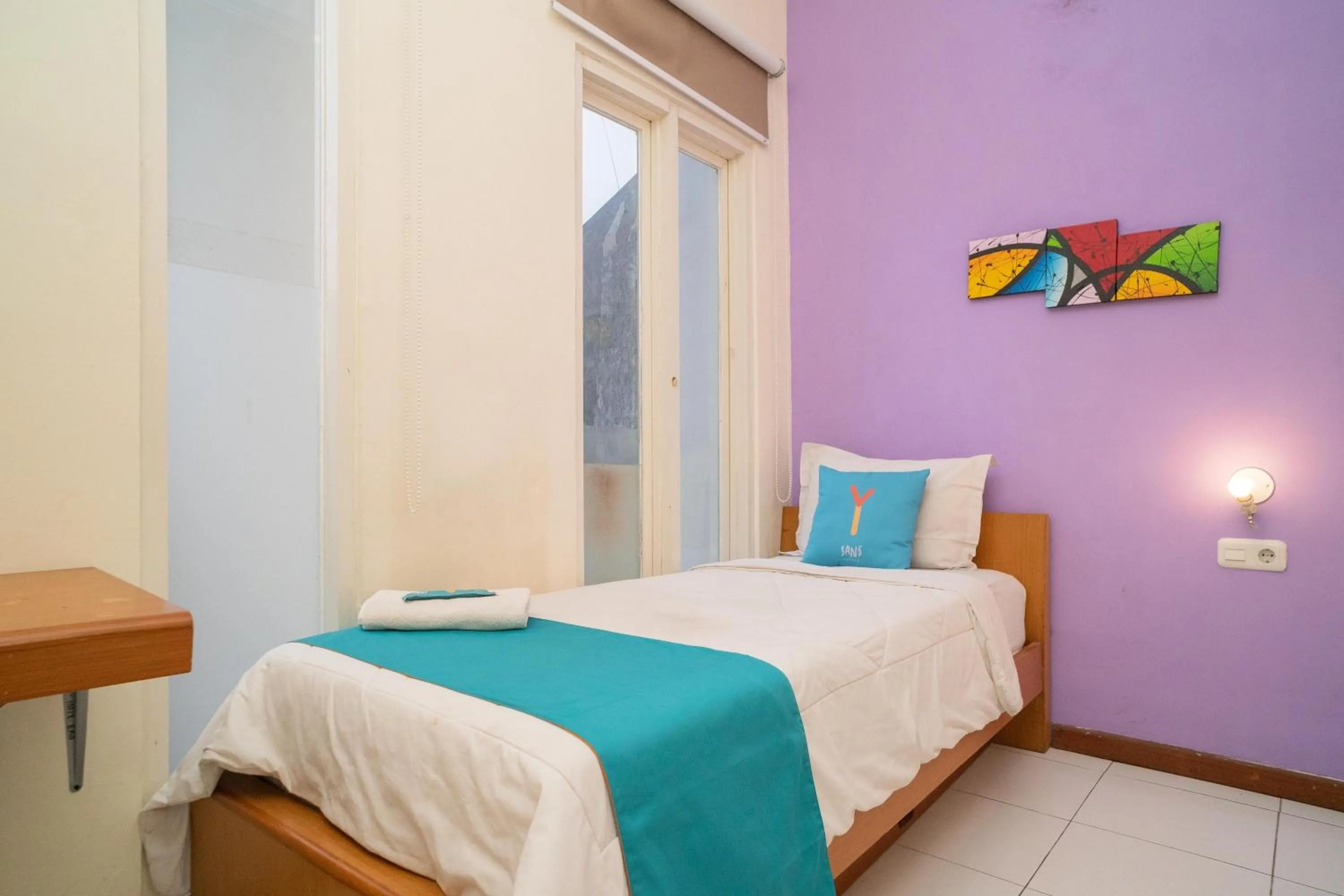 Bed in Sans Hotel FiFFa Pisang Kipas Malang