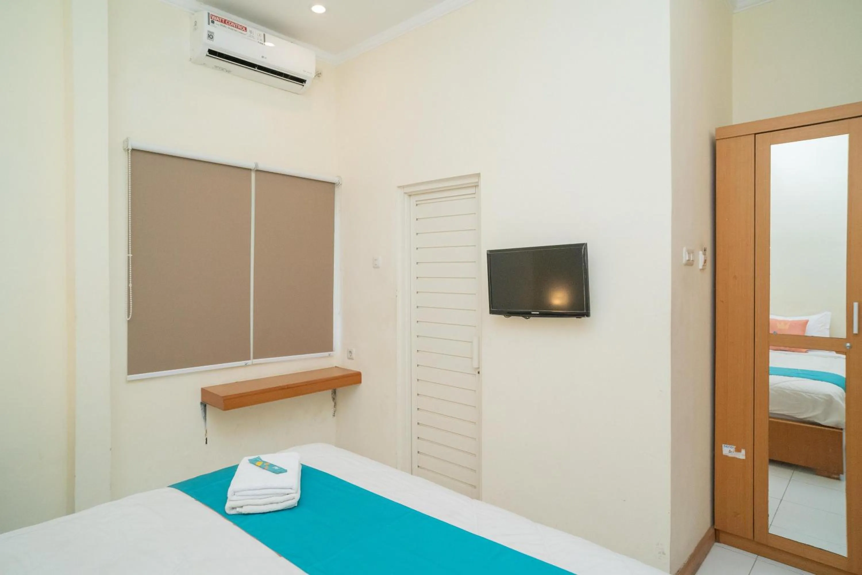 Bed in Sans Hotel FiFFa Pisang Kipas Malang